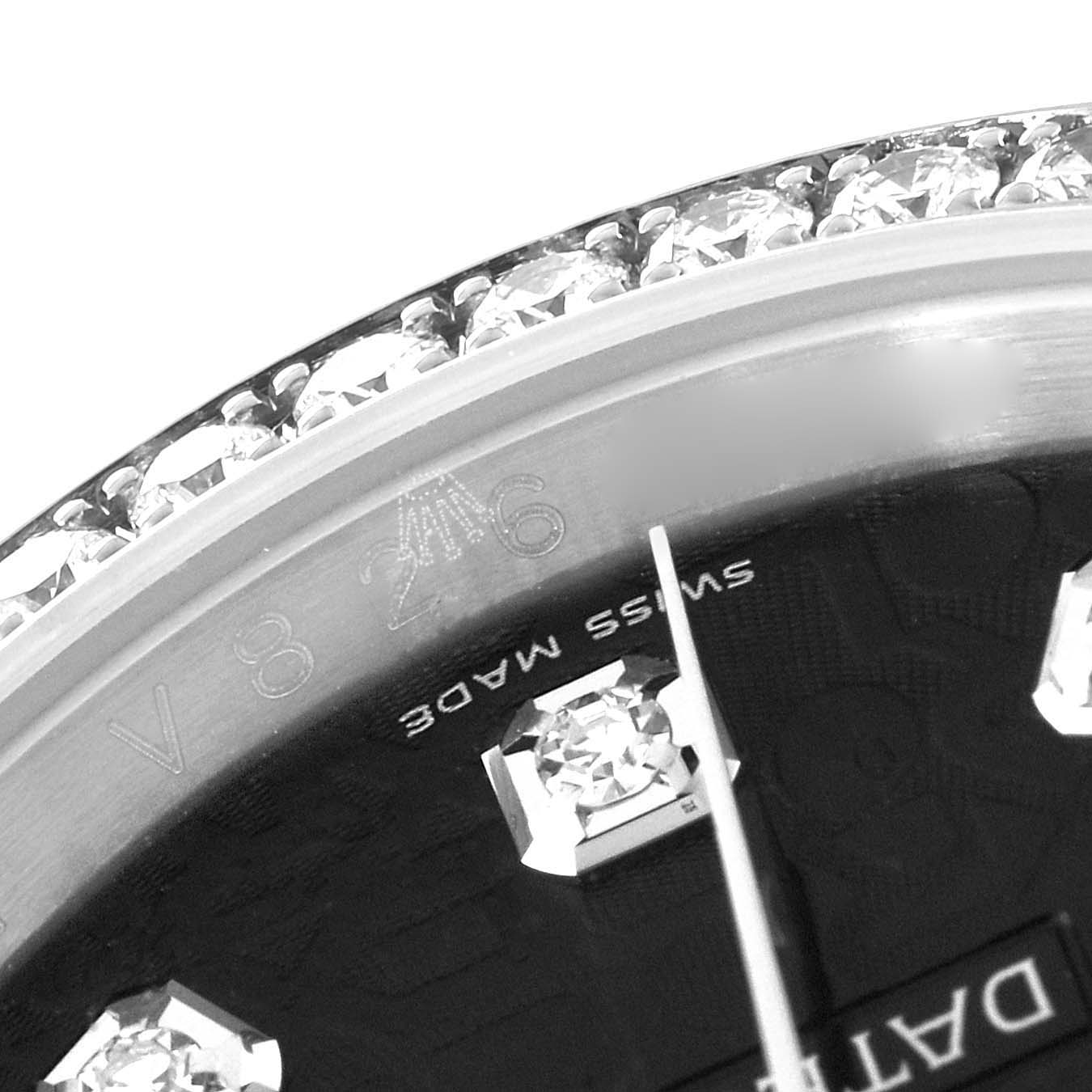 This close-up image of a Rolex Datejust 116244 Men's Stainless Steel Black Dial 116244 Men's Stainless Steel Black Dial shows the bezel and a portion of the dial with diamond hour markers.
