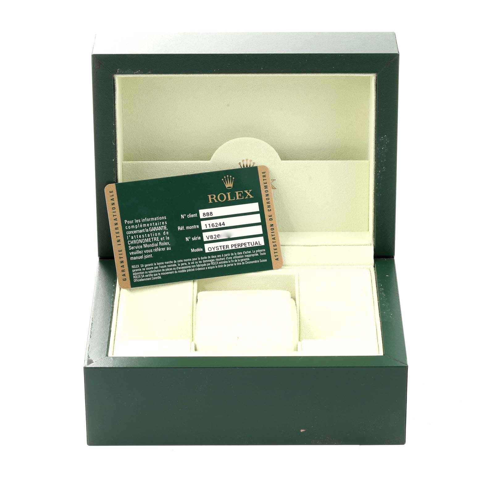 This image shows the open box and warranty card for the Rolex Datejust 116244 Men's Stainless Steel Black Dial 116244 Men's Stainless Steel Black Dial watch.