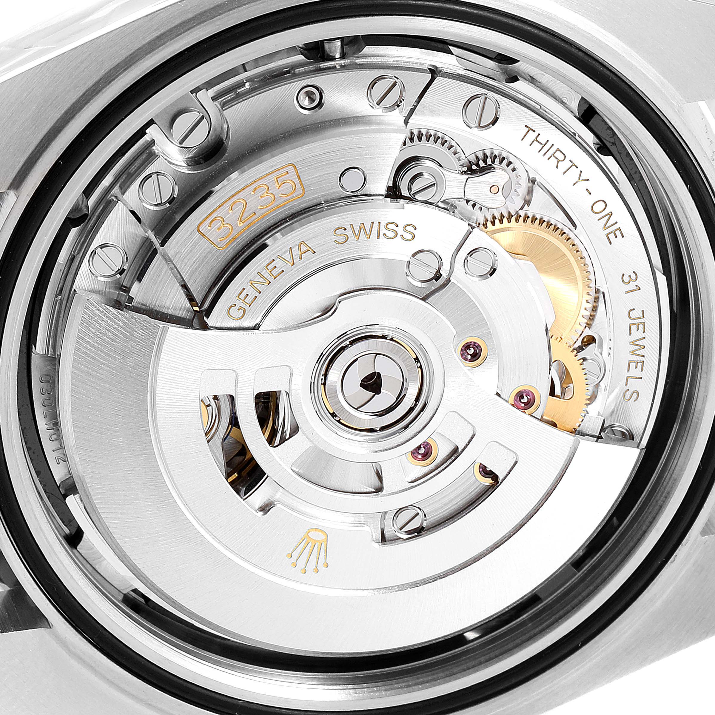 The image shows the movement of a Rolex Datejust 41 126300 Men's Stainless Steel Black Dial 126300 Men's Stainless Steel Black Dial model, viewed from the case back, highlighting the intricate components and engravings.