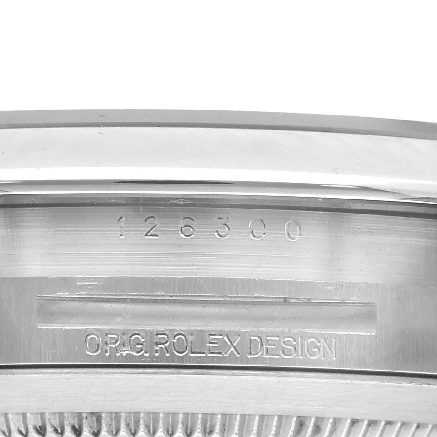 This image shows a close-up of the side of the case of a Rolex Datejust 41 126300 Men
s Stainless Steel Silver Dial 126300 Men
s Stainless Steel Silver Dial, highlighting the serial number and "ORG. ROLEX DESIGN" engraving.