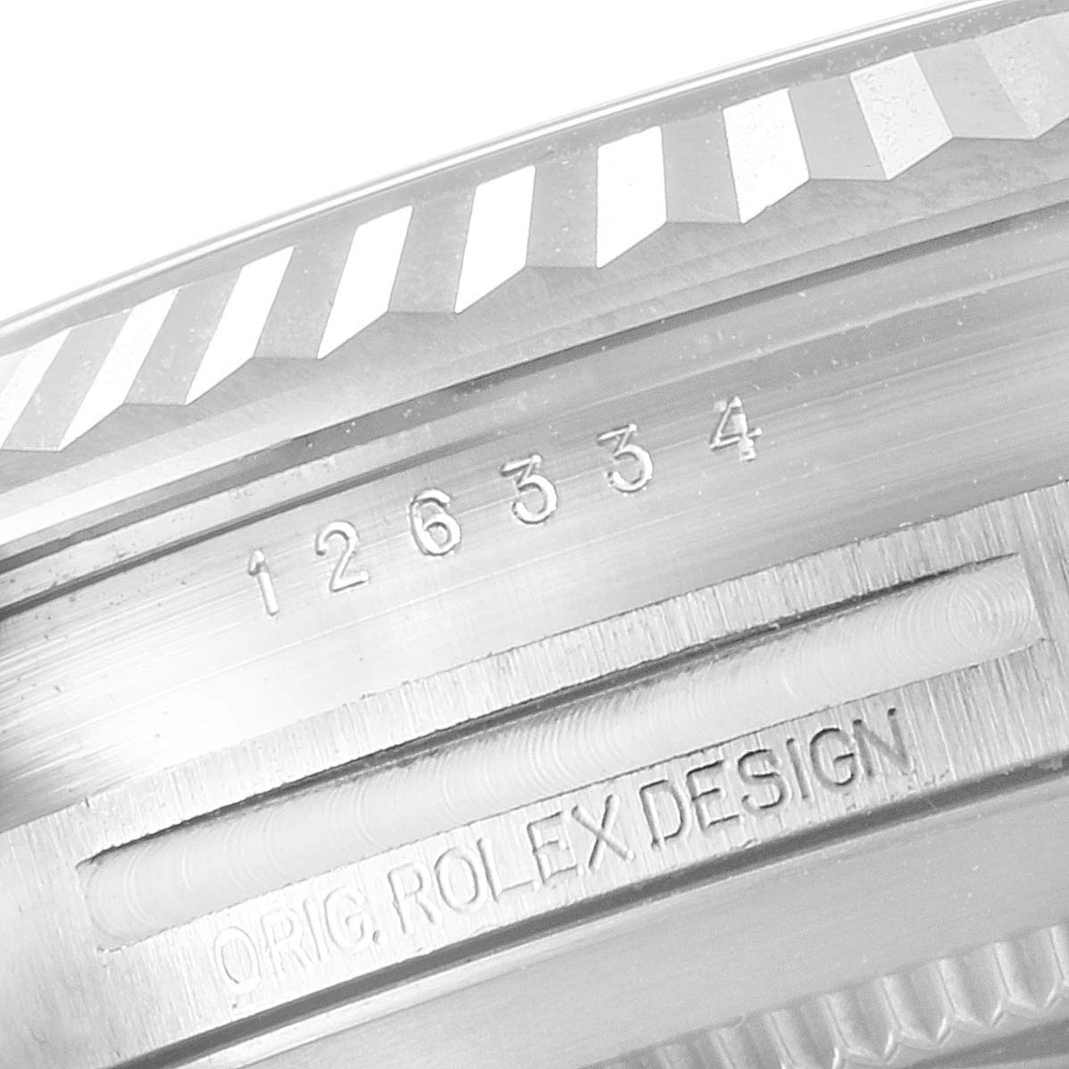 This close-up image shows the engraved serial number and "ORIG. ROLEX DESIGN" marking on the caseback of a Rolex Datejust 41 126334 Men
s Stainless Steel Black Dial 126334 Men
s Stainless Steel Black Dial watch.