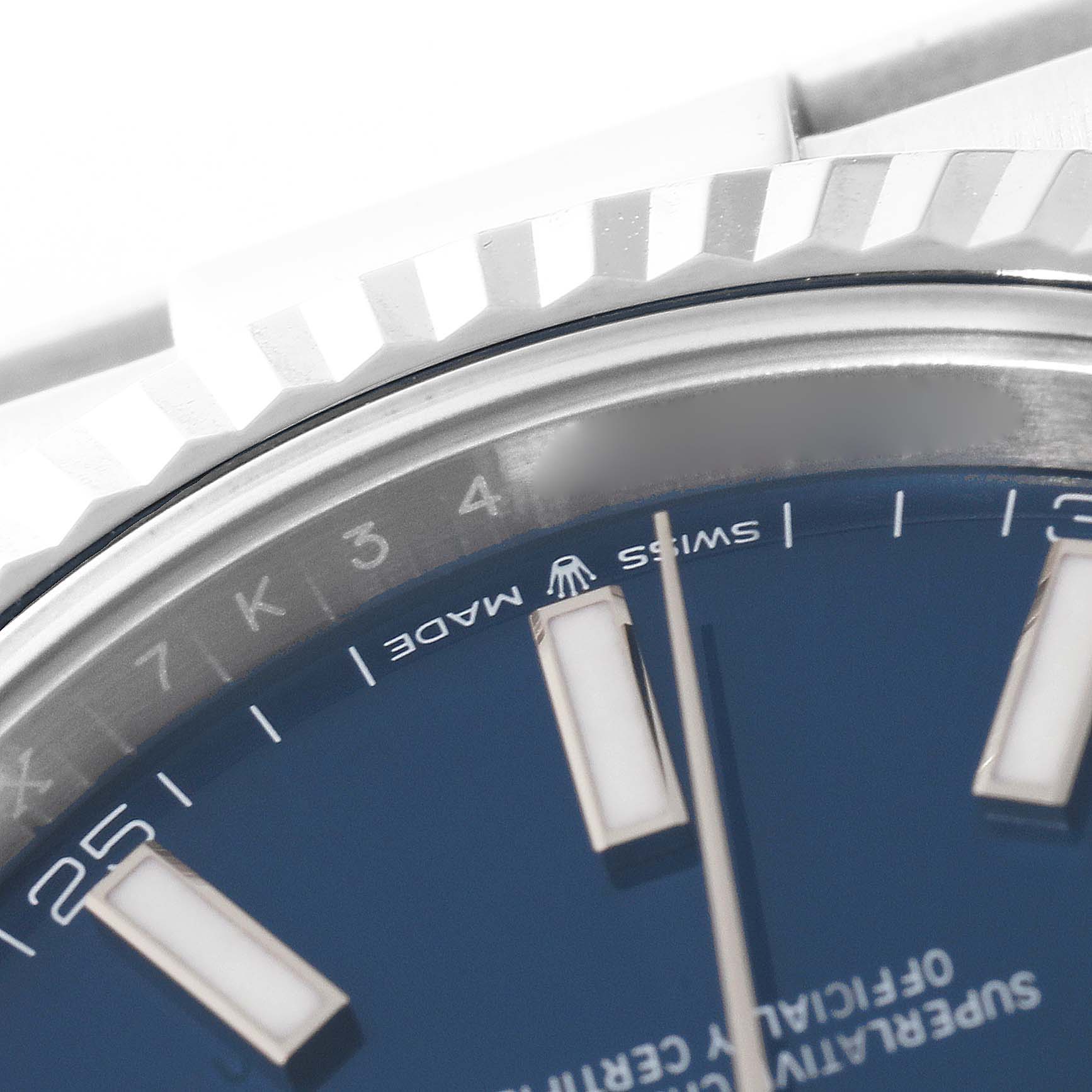 This close-up image of the Rolex Datejust 41 126334 Men's Stainless Steel Blue Dial 126334 Men's Stainless Steel Blue Dial watch shows the bezel, part of the blue dial, indices, and "SWISS MADE" text.
