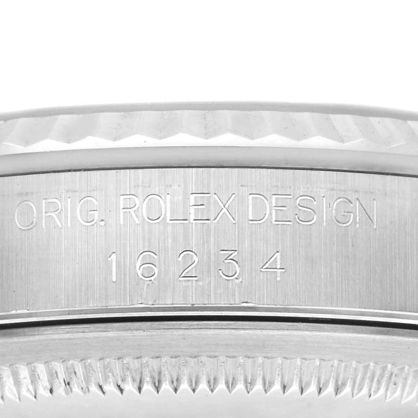 This image shows an up-close view of the casing with "ORIG. ROLEX DESIGN" and a serial number of a Rolex Datejust 16234 Men
s Stainless Steel Black Dial 16234 Men
s Stainless Steel Black Dial model watch.