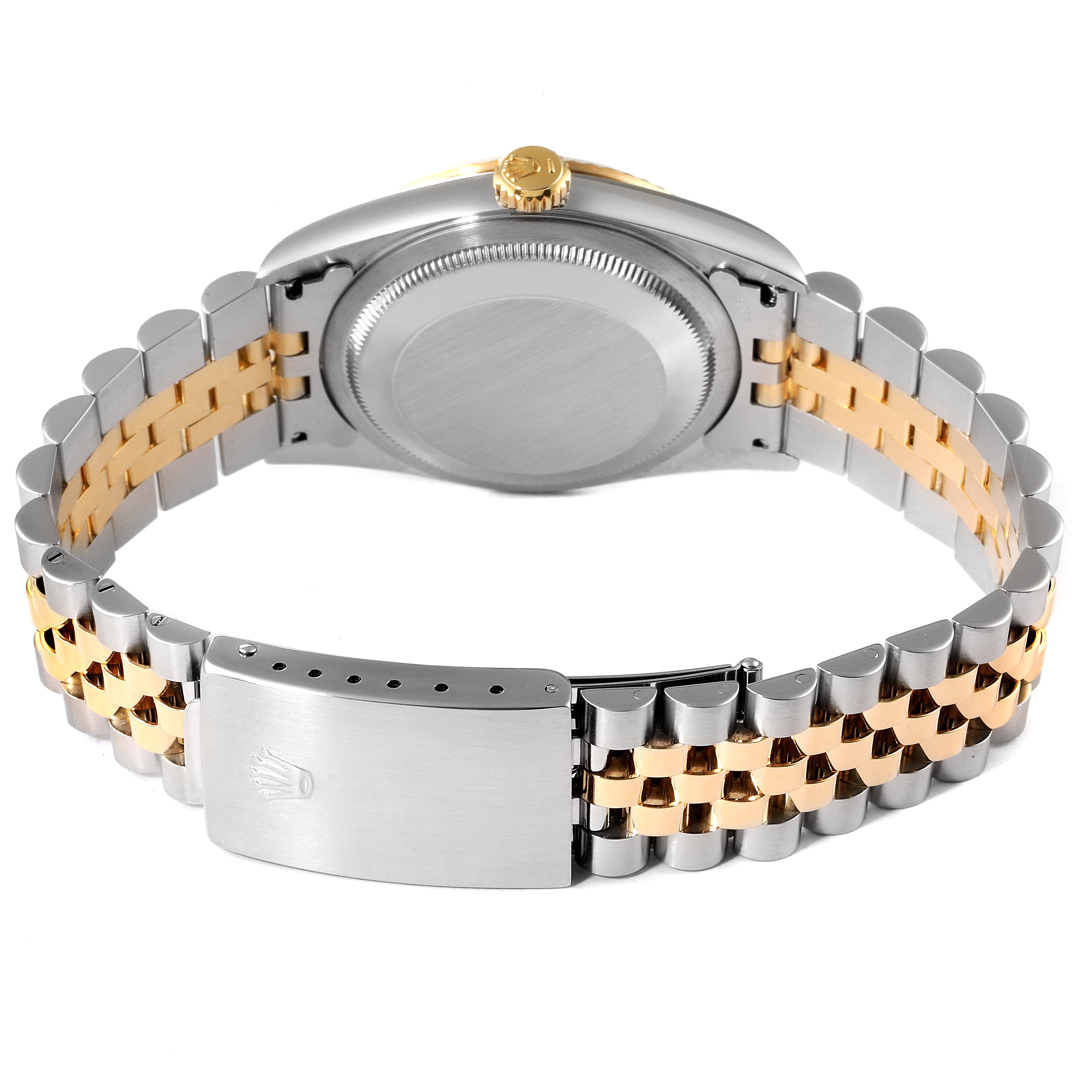 This image shows the back view of a Rolex Datejust 16233 Men's Steel and Gold (two tone) Champagne Dial 16233 Men's Steel and Gold (two tone) Champagne Dial watch, focusing on the case back, crown, and two-tone bracelet with the clasp.