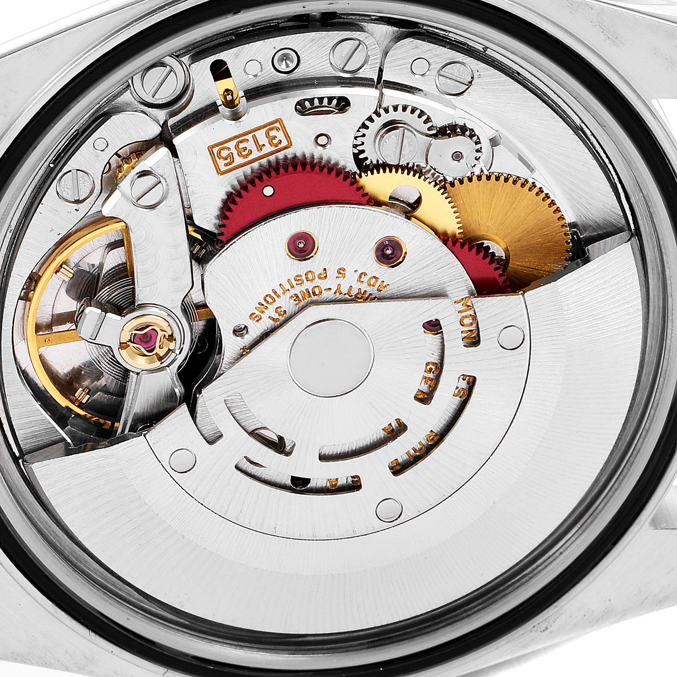 The image shows the internal mechanism of a Rolex Datejust 16233 Men's Steel and Gold (two tone) Champagne Dial 16233 Men's Steel and Gold (two tone) Champagne Dial, emphasizing the gears and movement parts.