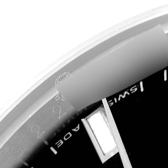 This image shows a close-up of the dial and side of the bezel of a Rolex Datejust 179174 Women's Stainless Steel Black Dial 179174 Women's Stainless Steel Black Dial watch.