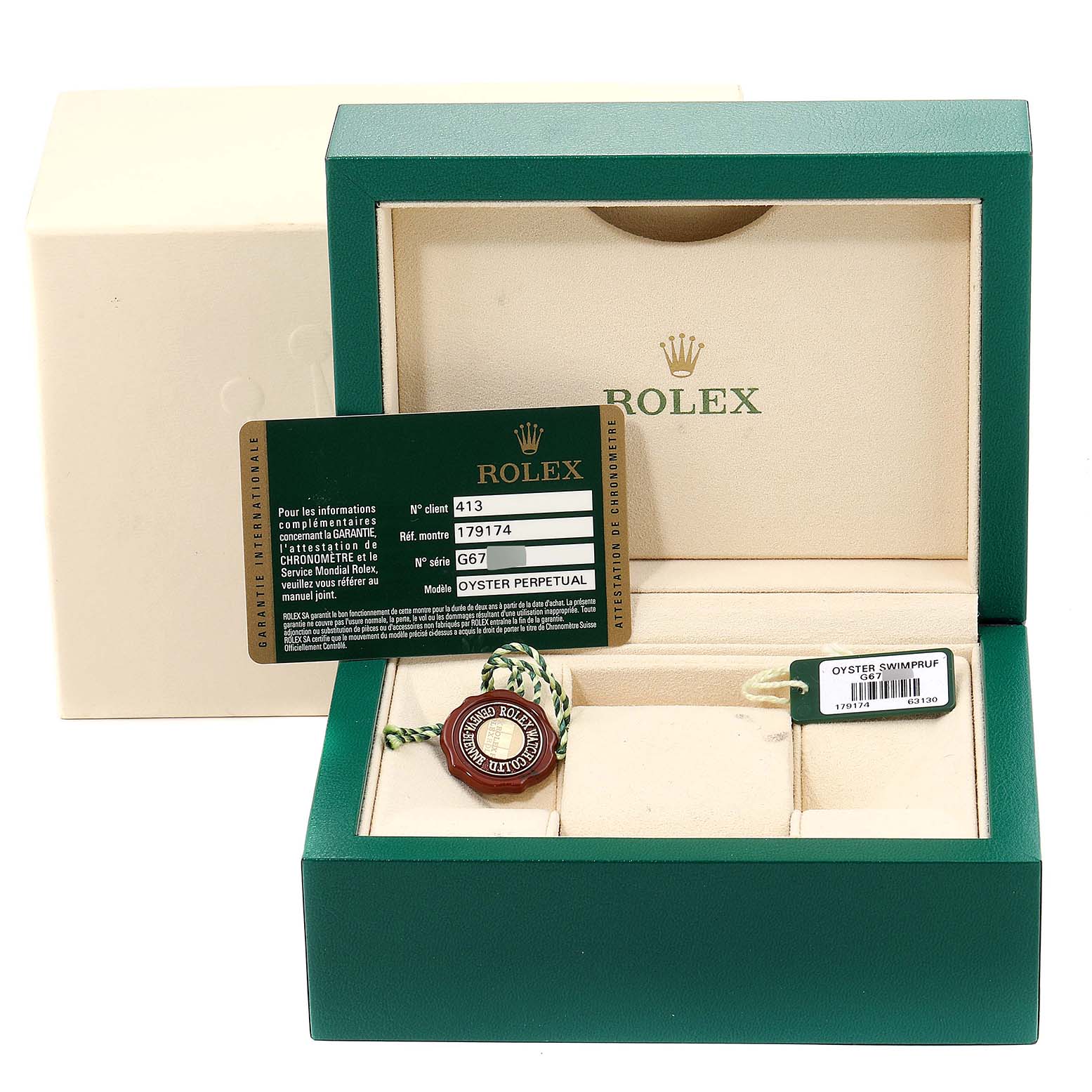 The image shows an open Rolex Datejust 179174 Women's Stainless Steel Silver Dial 179174 Women's Stainless Steel Silver Dial watch box with a warranty card, tag, and green and white string.