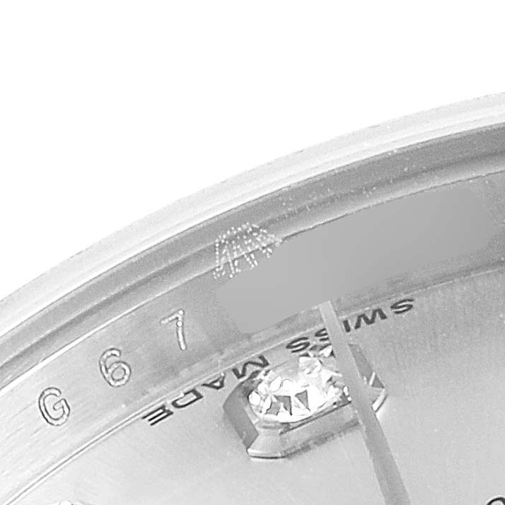 The image shows a close-up of the dial and bezel of a Rolex Datejust 179174 Women's Stainless Steel Silver Dial 179174 Women's Stainless Steel Silver Dial watch, highlighting the "Swiss Made" text and part of the diamond marker.