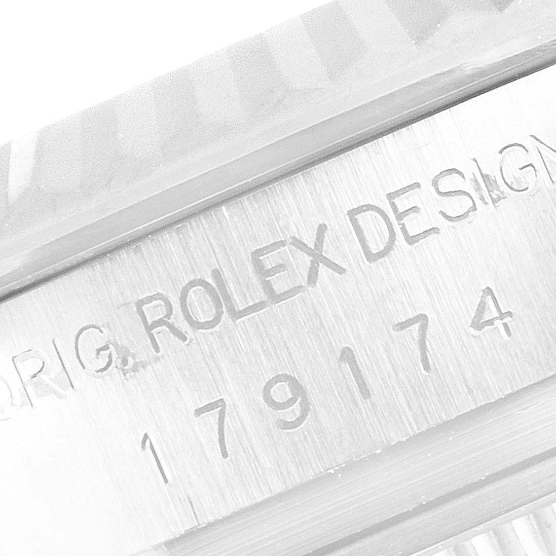 The image shows a close-up angle of the case with serial number engravings on a Rolex Datejust 179174 Women's Stainless Steel Silver Dial 179174 Women's Stainless Steel Silver Dial watch.