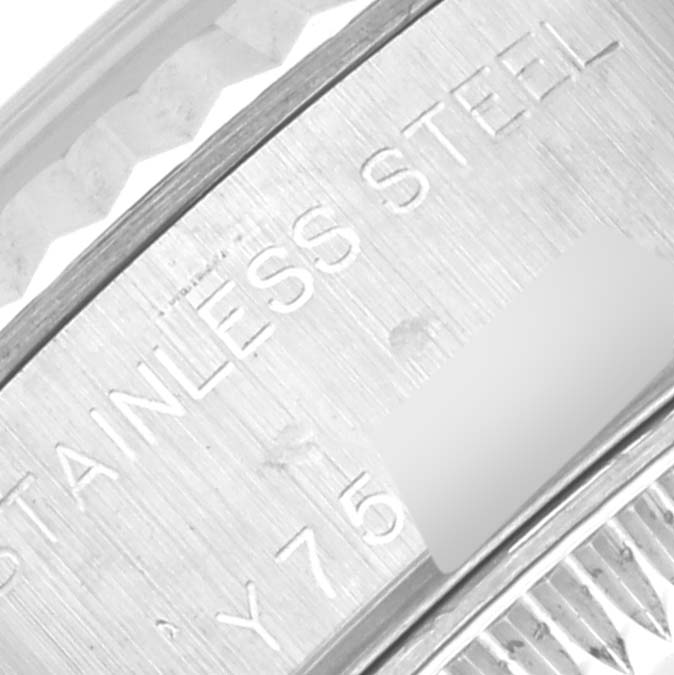 This close-up image shows the stainless-steel case and part of the serial number of a Rolex Datejust 79174 Women
s Stainless Steel Mother of Pearl Dial 79174 Women
s Stainless Steel Mother of Pearl Dial watch.