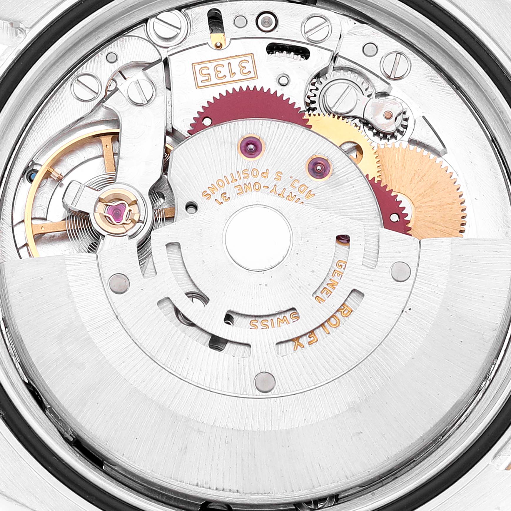 The image shows a close-up of the internal mechanism of a Rolex Datejust 116233 Men's Steel and Gold (two tone) Black Dial 116233 Men's Steel and Gold (two tone) Black Dial, highlighting its gears and movement components.