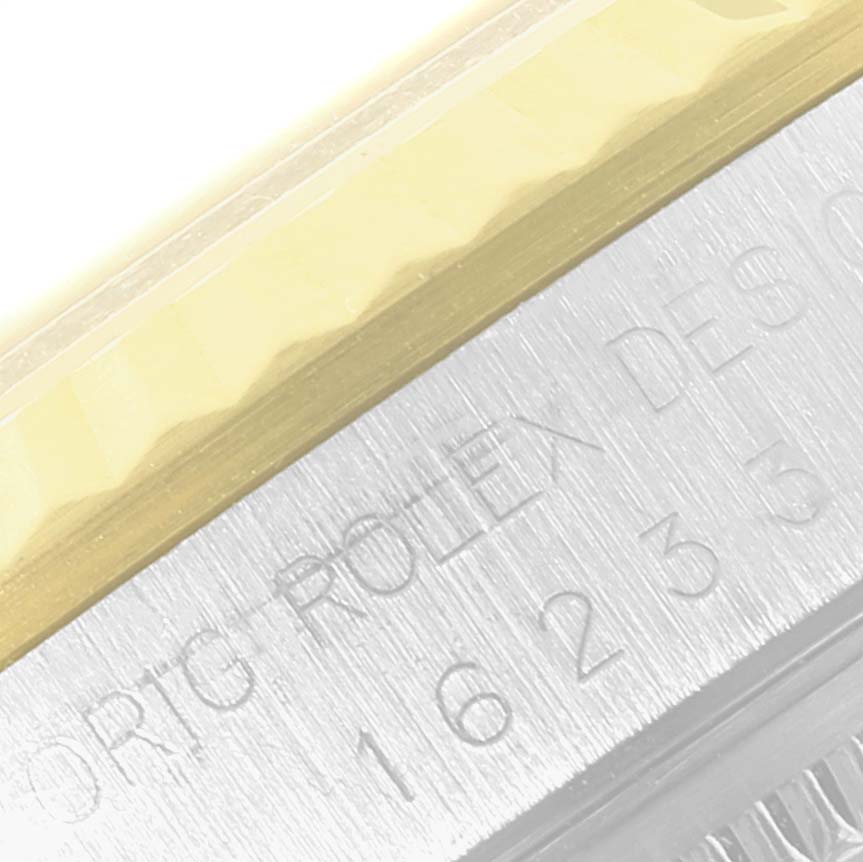 The image shows a close-up angle of the bezel and case side of a Rolex Datejust 16233 Men's Steel and Gold (two tone) Black Dial 16233 Men's Steel and Gold (two tone) Black Dial watch with part of the model number visible.
