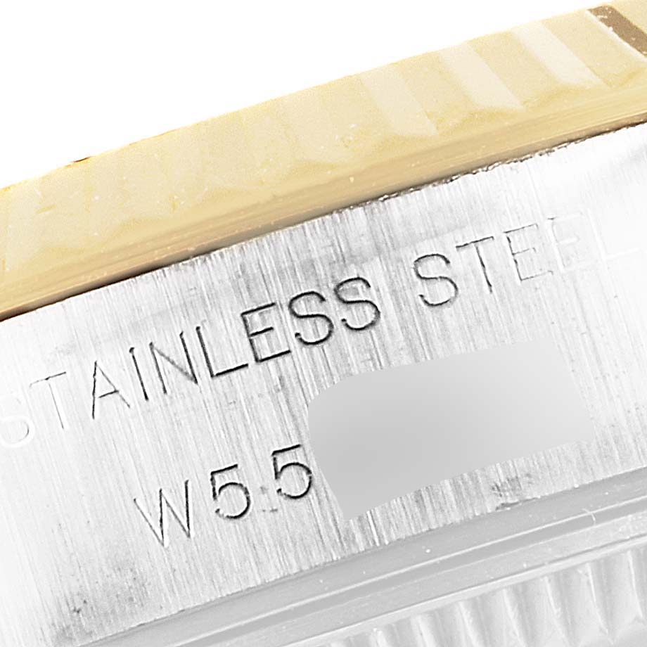 This close-up image shows the side of the case and part of the bezel of a Rolex Datejust 69173 Women's Steel and Gold (two tone) Grey Dial 69173 Women's Steel and Gold (two tone) Grey Dial watch, highlighting the "STAINLESS STEEL" engraving.