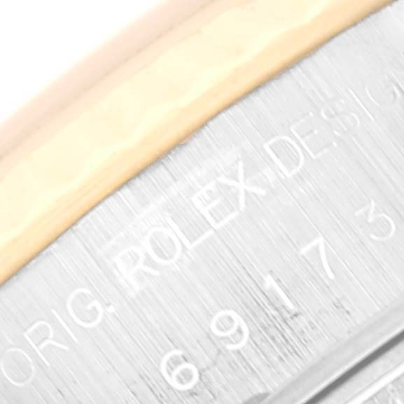 The image shows a close-up of the engraved design details on a Rolex Datejust 69173 Women's Steel and Gold (two tone) Champagne Dial 69173 Women's Steel and Gold (two tone) Champagne Dial watch.