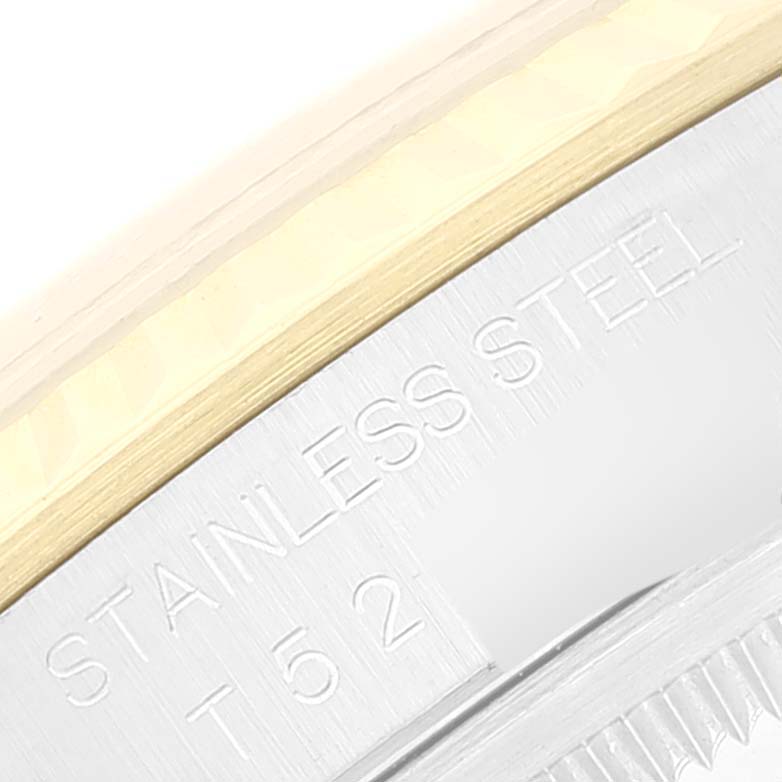 This close-up angle shows engraved text on the case back of a Rolex Datejust 16233 Men's Steel and Gold (two tone) Champagne Dial 16233 Men's Steel and Gold (two tone) Champagne Dial watch.