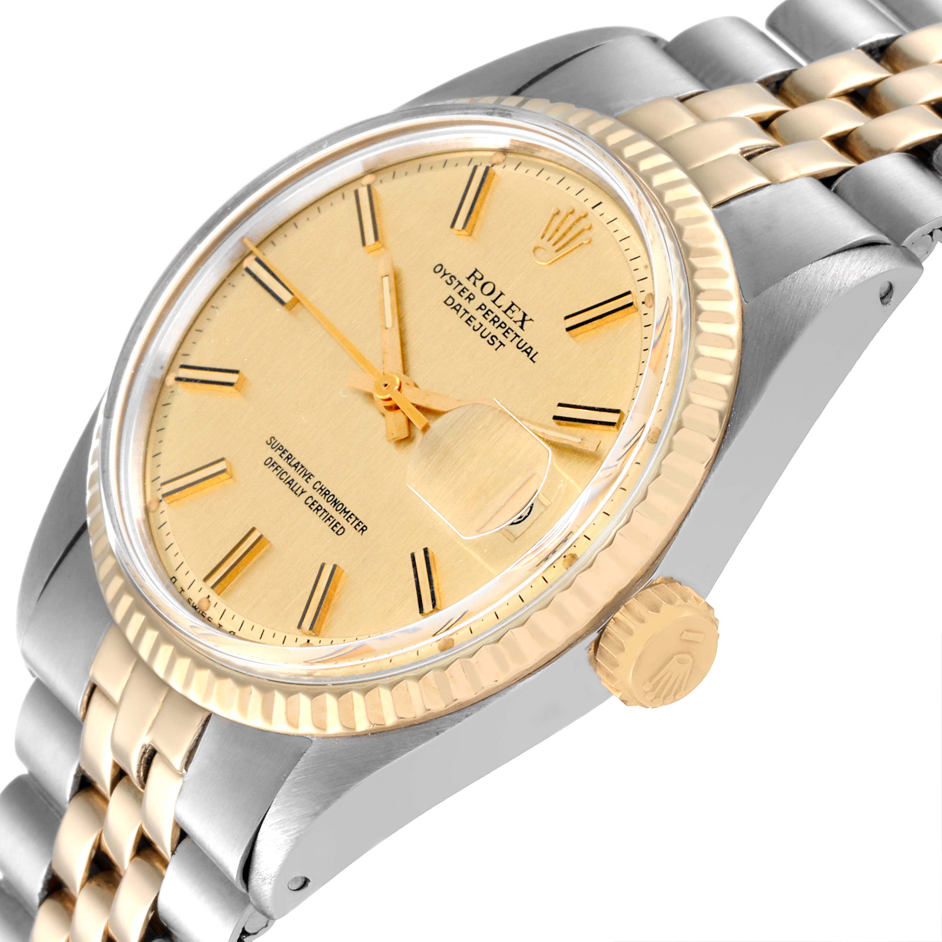 The image shows a Rolex Vintage Collection 1601 Men
s Steel and Gold (two tone) Champagne Dial 1601 Men
s Steel and Gold (two tone) Champagne Dial Oyster Perpetual Datejust watch at an angled close-up, detailing the dial, crown, and part of the bracelet.