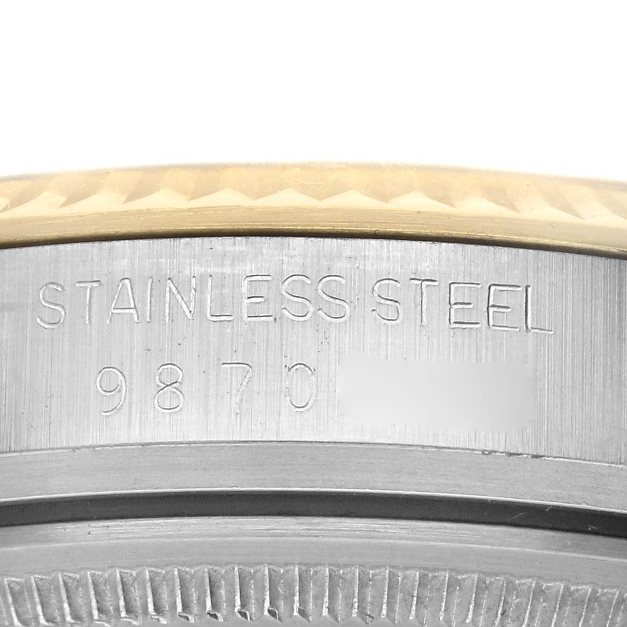 This image shows a close-up of the stainless steel case back partially exposing the model and serial number of a Rolex Vintage Collection 16013 Men's Steel and Gold (two tone) Champagne Dial 16013 Men's Steel and Gold (two tone) Champagne Dial watch.