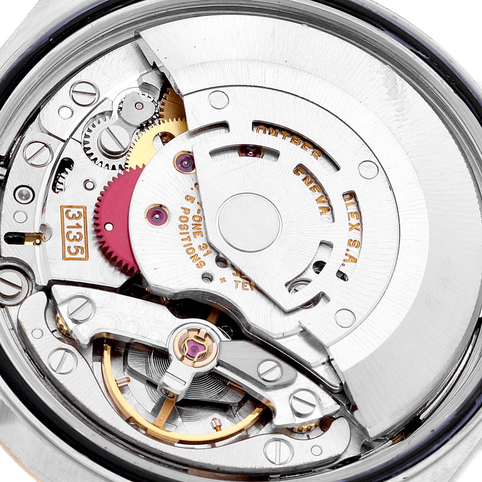 This image shows a close-up view of the Rolex Datejust 16233 Men's Steel and Gold (two tone) White Dial 16233 Men's Steel and Gold (two tone) White Dial watch's internal movement mechanism.