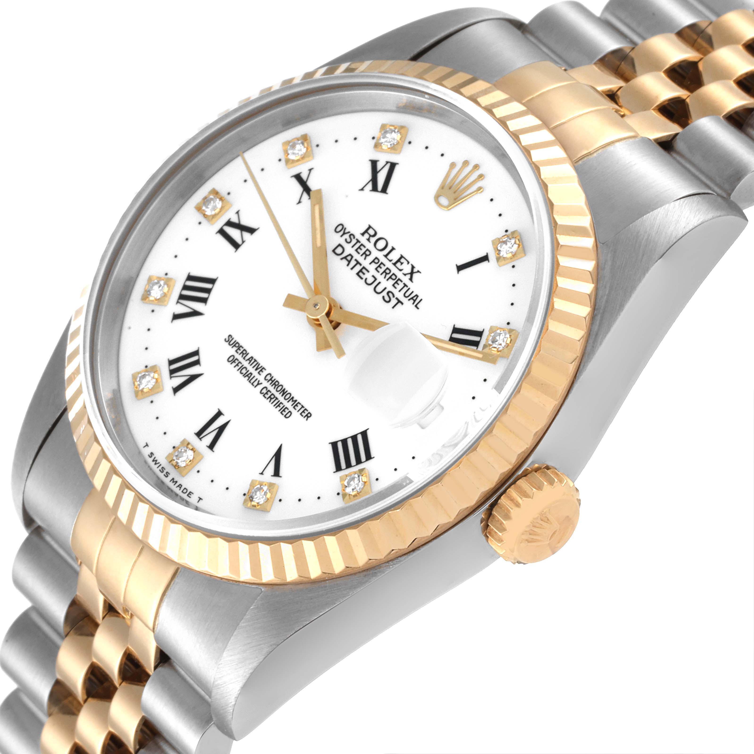 The image shows a close-up of the Rolex Datejust 16233 Men's Steel and Gold (two tone) White Dial 16233 Men's Steel and Gold (two tone) White Dial watch from the top right angle, highlighting the dial, bezel, crown, and part of the bracelet.