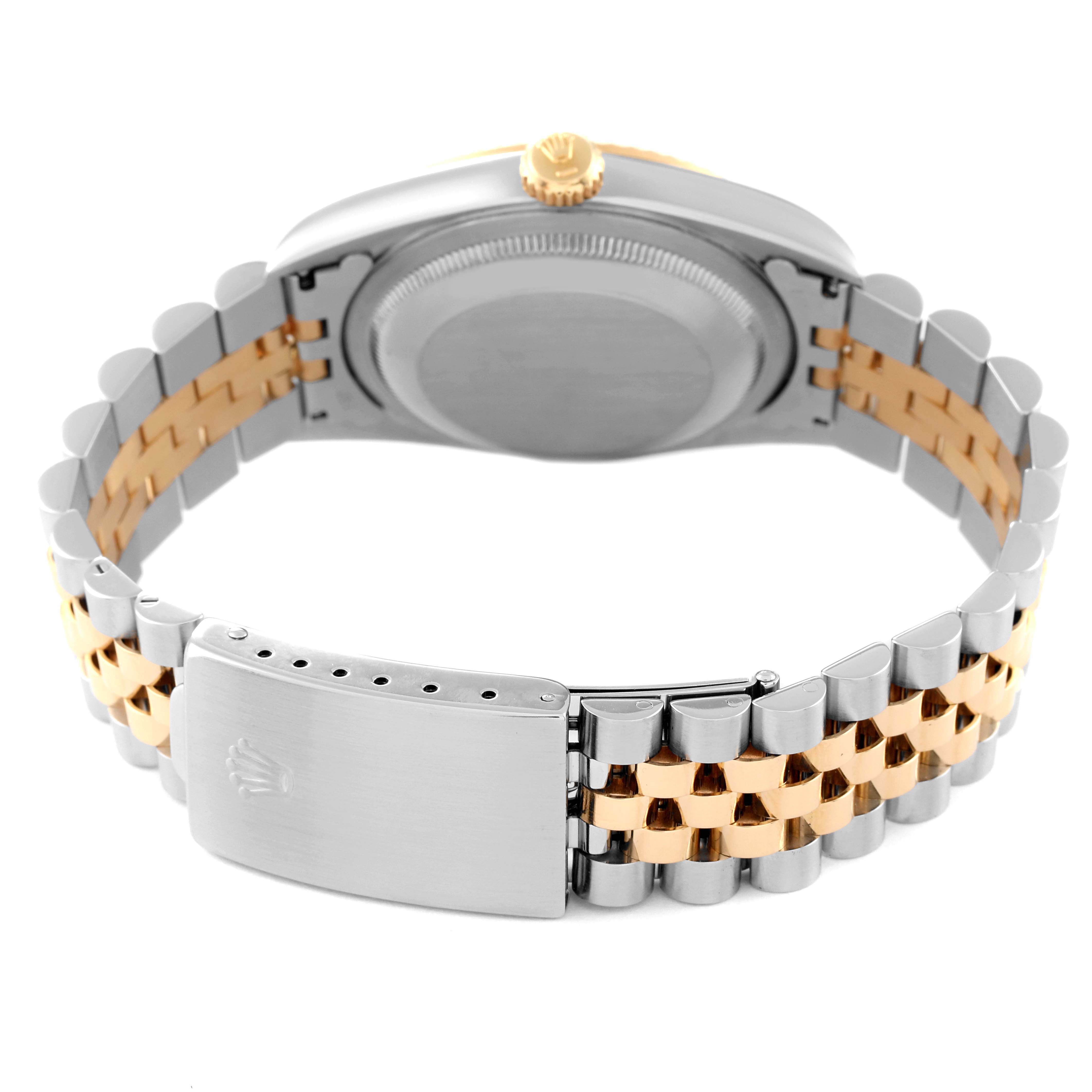 The image shows the back of a Rolex Datejust 16233 Men's Steel and Gold (two tone) White Dial 16233 Men's Steel and Gold (two tone) White Dial watch, highlighting the case back, crown, and two-tone bracelet with a clasp.