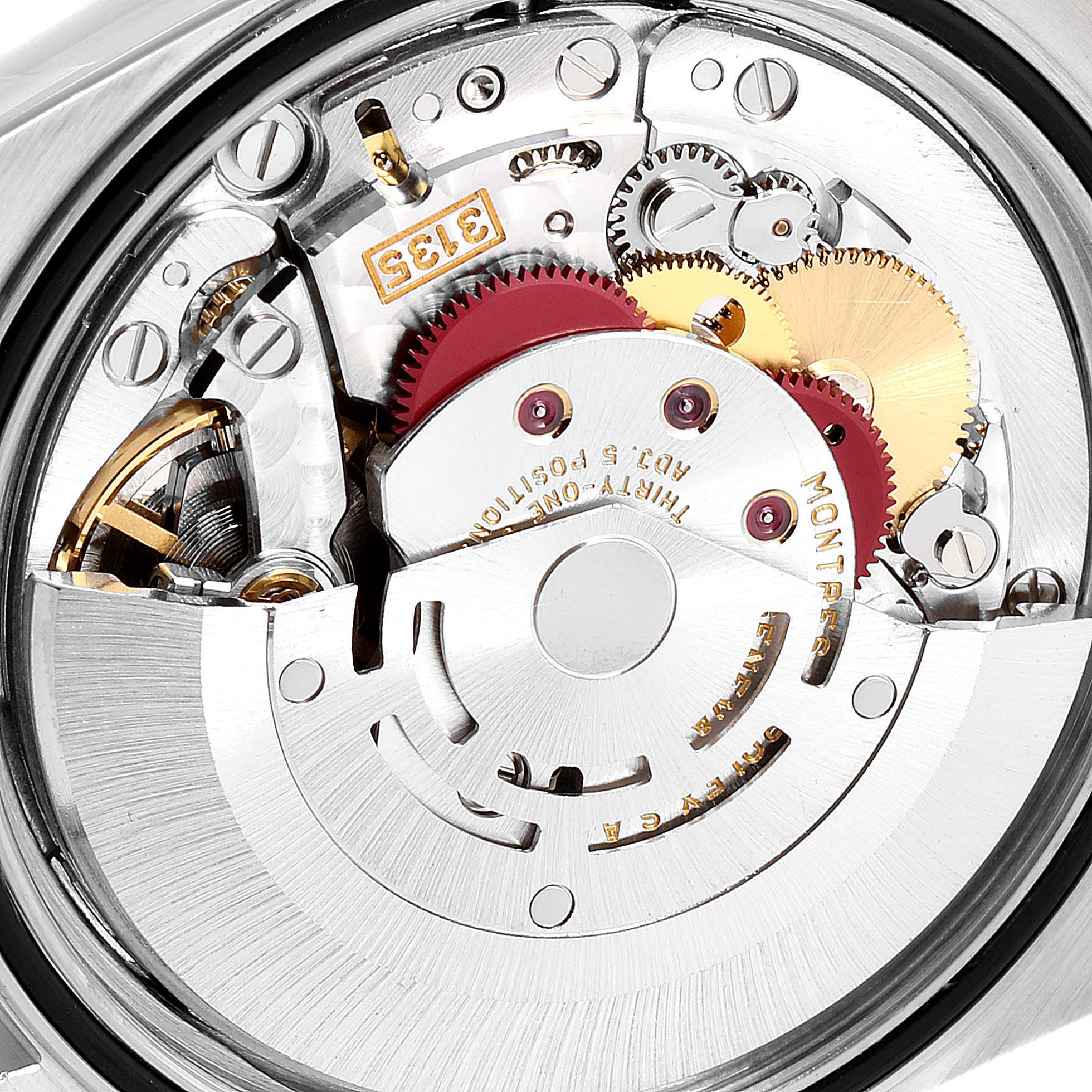 This image shows the internal mechanics of a Rolex Datejust 16233 Men's Steel and Gold (two tone) White Dial 16233 Men's Steel and Gold (two tone) White Dial watch, highlighting its gears and movement components.