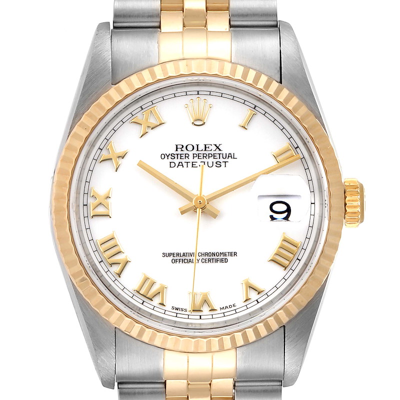 The image shows a Rolex Datejust watch face and band from a front angle, featuring gold and silver tones with a date window at 3 o'clock.