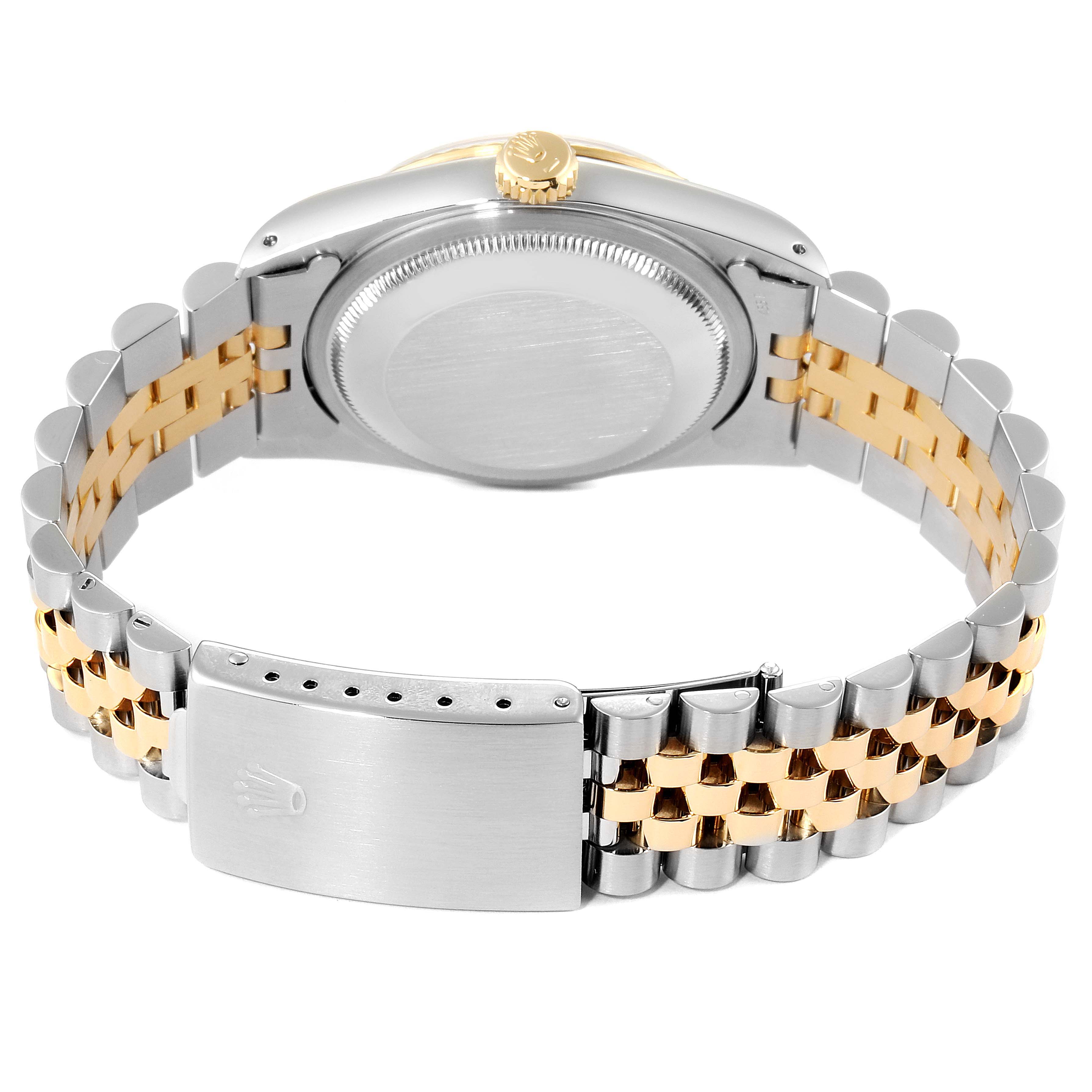 The image shows the back view of a Rolex Datejust 16233 Men's Steel and Gold (two tone) White Dial 16233 Men's Steel and Gold (two tone) White Dial watch, highlighting the case back and bicolored metal bracelet with clasp.