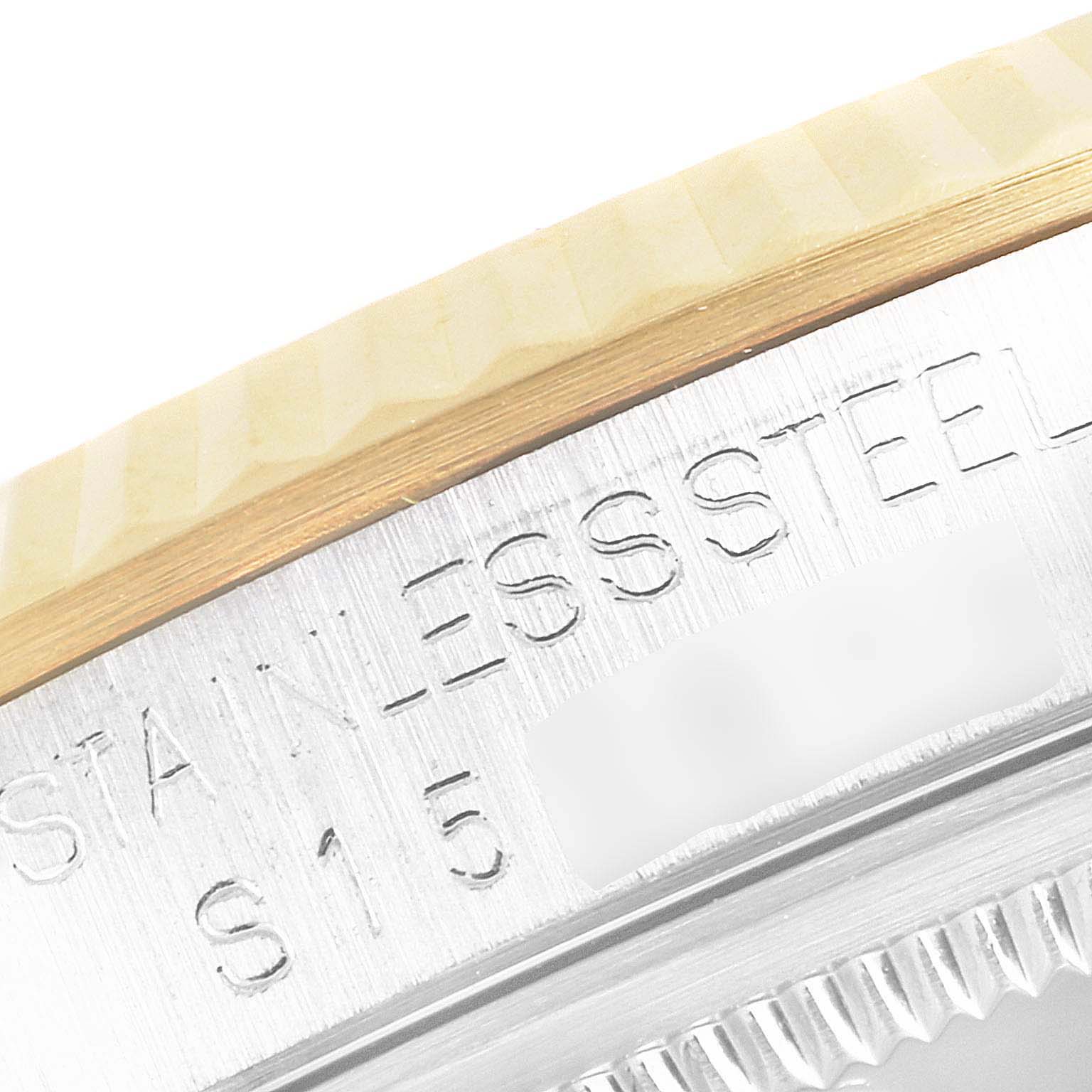 This image shows a close-up of the side engraving and bezel of a Rolex Datejust 16233 Men's Steel and Gold (two tone) White Dial 16233 Men's Steel and Gold (two tone) White Dial watch, highlighting the text "STAINLESS STEEL."