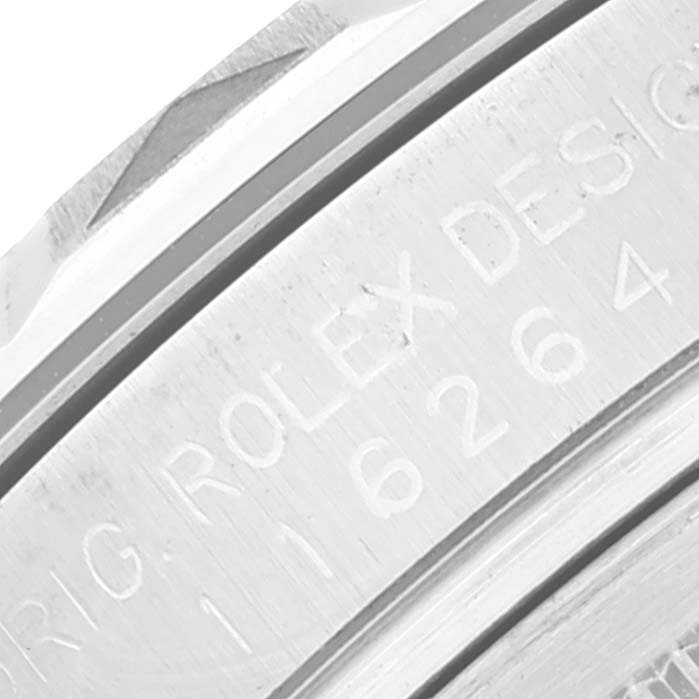 The image shows a close-up angle of the engraved bezel and part of the case of a Rolex Turn-o-Graph 116264 Men
s Stainless Steel White Dial 116264 Men
s Stainless Steel White Dial watch.