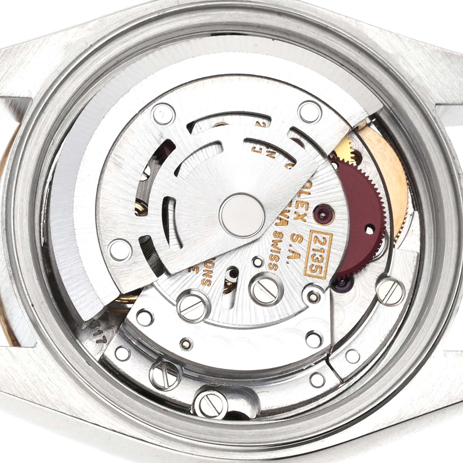 The image shows the inner mechanical movement of a Rolex Datejust 69173 Women's Steel and Gold (two tone) Blue Dial 69173 Women's Steel and Gold (two tone) Blue Dial watch with the back case removed, highlighting the gears and rotor.