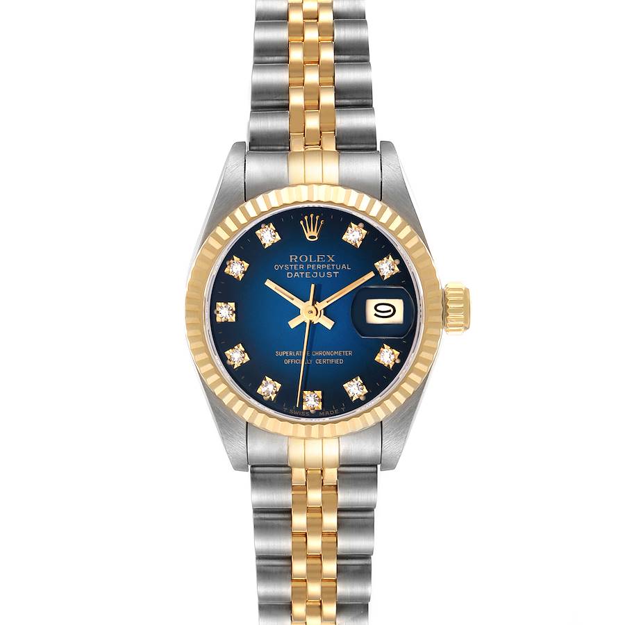 This image shows a Rolex Datejust watch with a two-tone bracelet, blue dial, gold fluted bezel, and a date window at 3 o'clock.