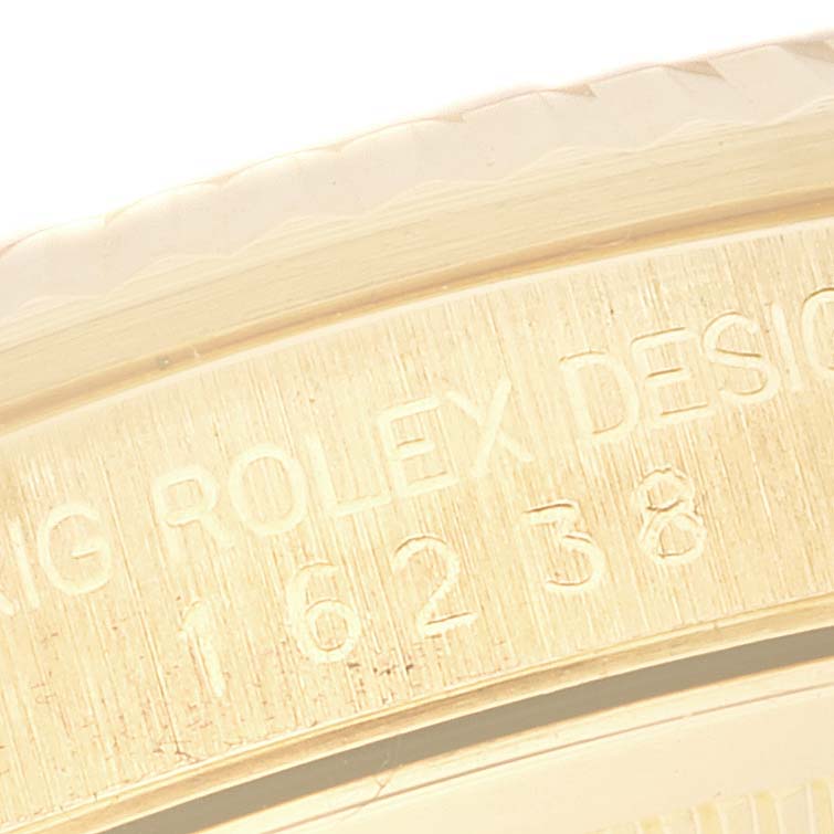 This image shows a close-up of the case side edge and engraving on a Rolex Datejust 16238 Men's Yellow Gold Champagne Dial 16238 Men's Yellow Gold Champagne Dial watch.