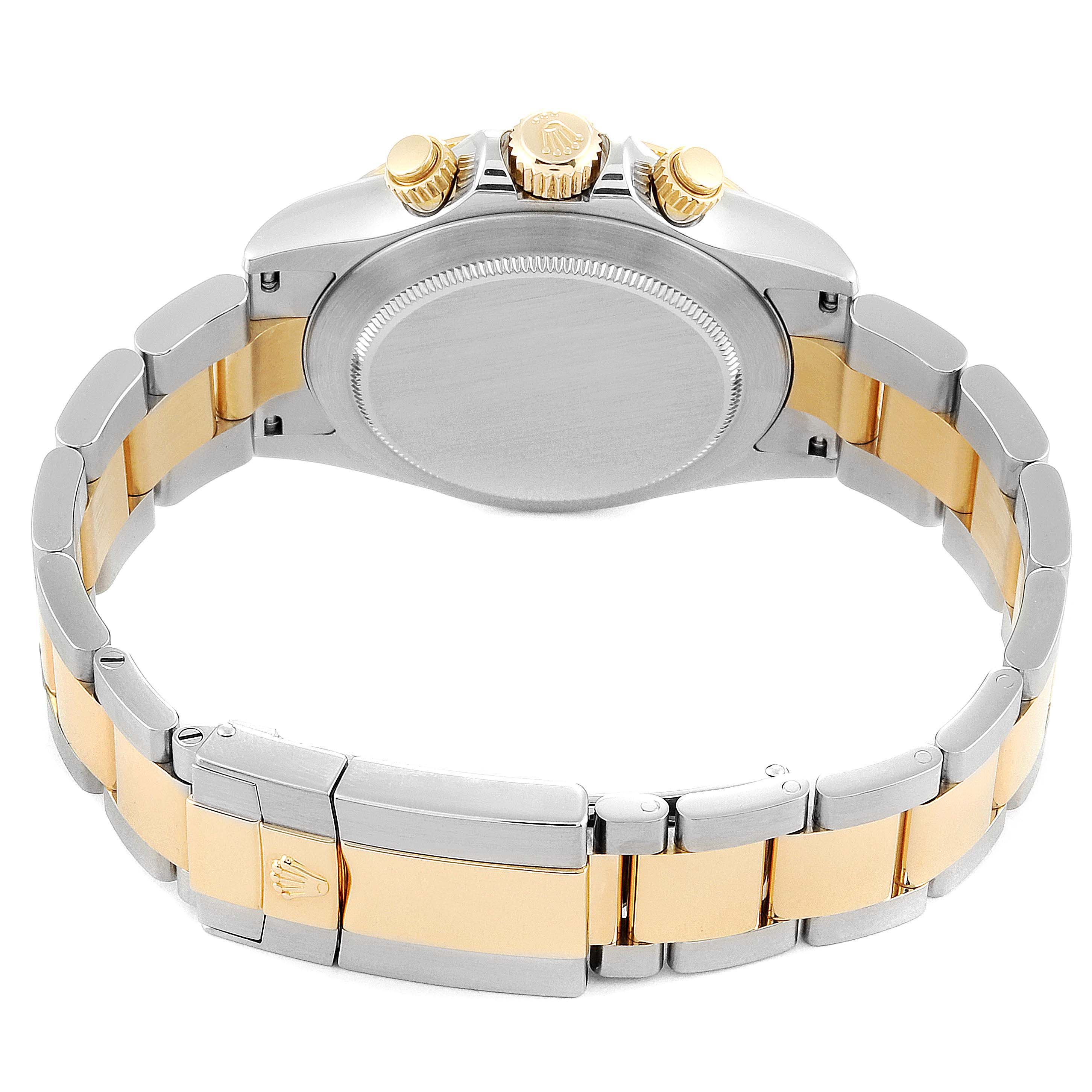 This image shows the back case and bracelet of a Rolex Daytona 116523 Men's Steel and Gold (two tone) Champagne Dial 116523 Men's Steel and Gold (two tone) Champagne Dial watch, highlighting the gold and silver Oyster bracelet and the crown.