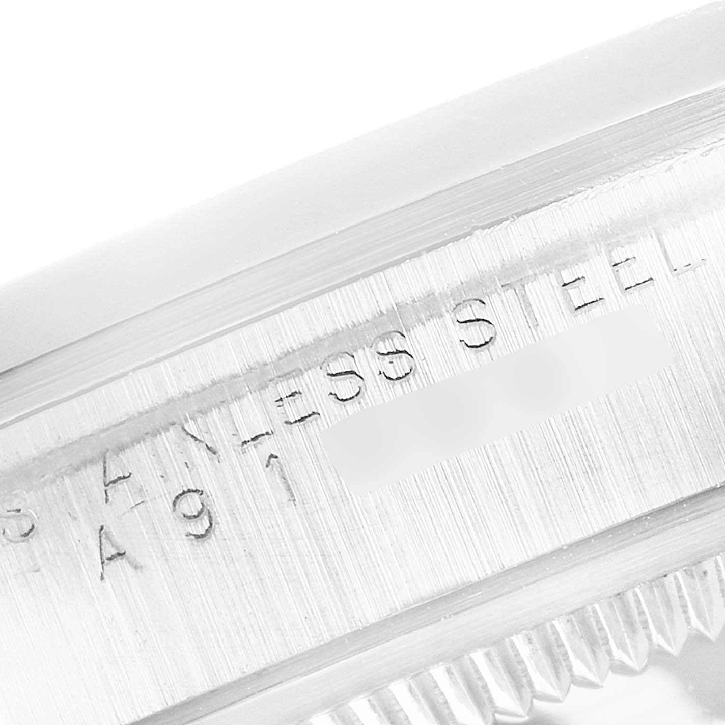 The image shows a close-up of the engraved "Stainless Steel" text on the edge of a Rolex Explorer 14270 Men's Stainless Steel Black Dial 14270 Men's Stainless Steel Black Dial watch bezel.