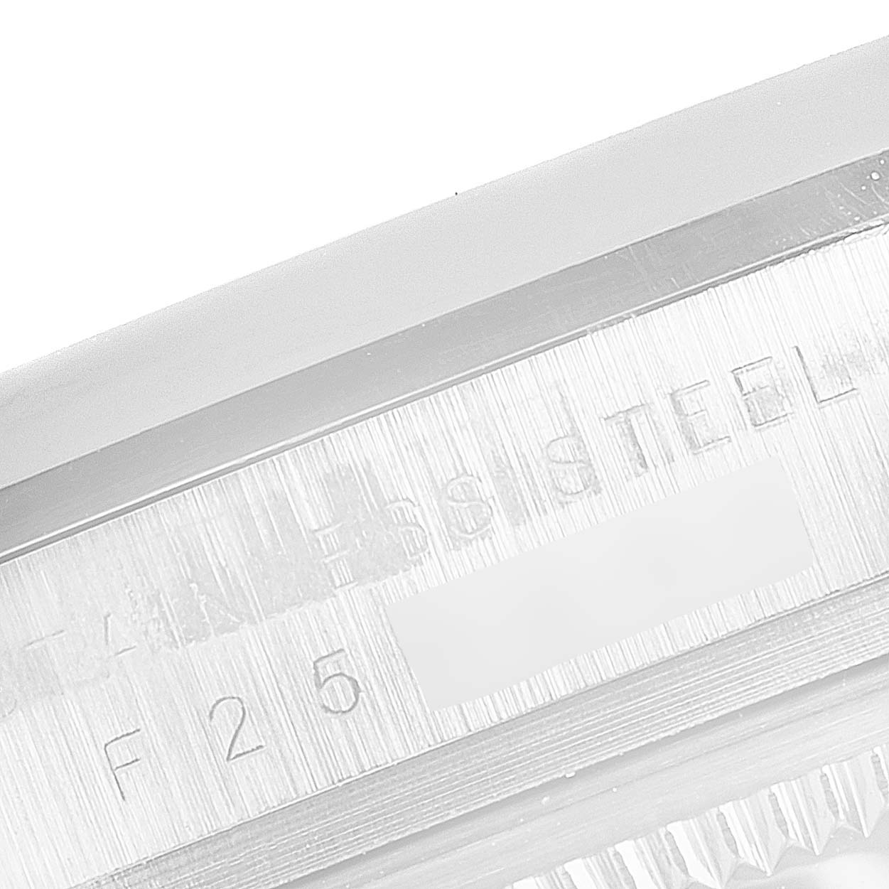 This image shows a close-up of the side of the bezel and case for the Rolex Explorer 114270 Men
s Stainless Steel Black Dial 114270 Men
s Stainless Steel Black Dial watch, with visible serial number engraving.