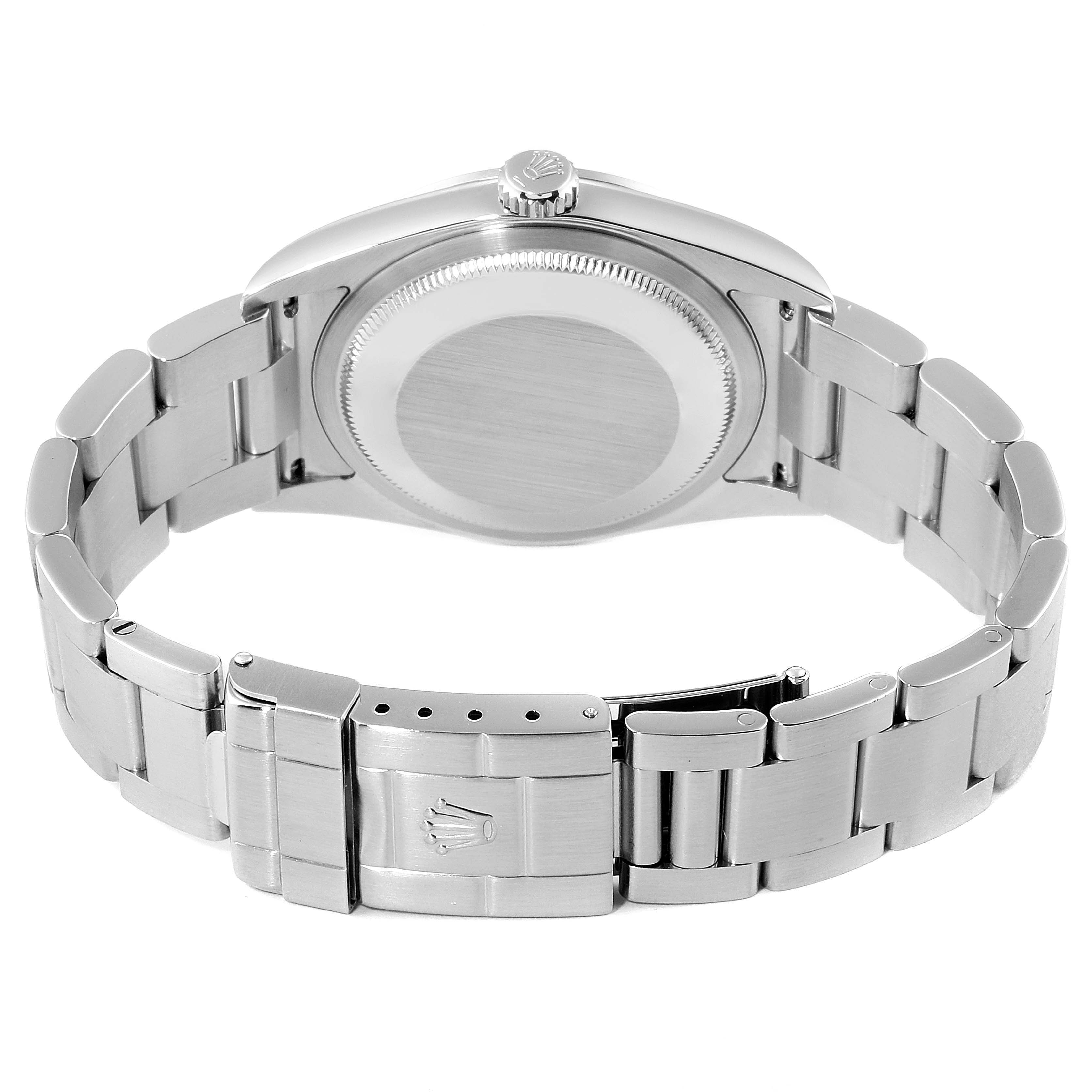 The image shows the back side of the Rolex Explorer 114270 Men
s Stainless Steel Black Dial 114270 Men
s Stainless Steel Black Dial watch, highlighting the stainless steel case and bracelet with the clasp and crown logo.