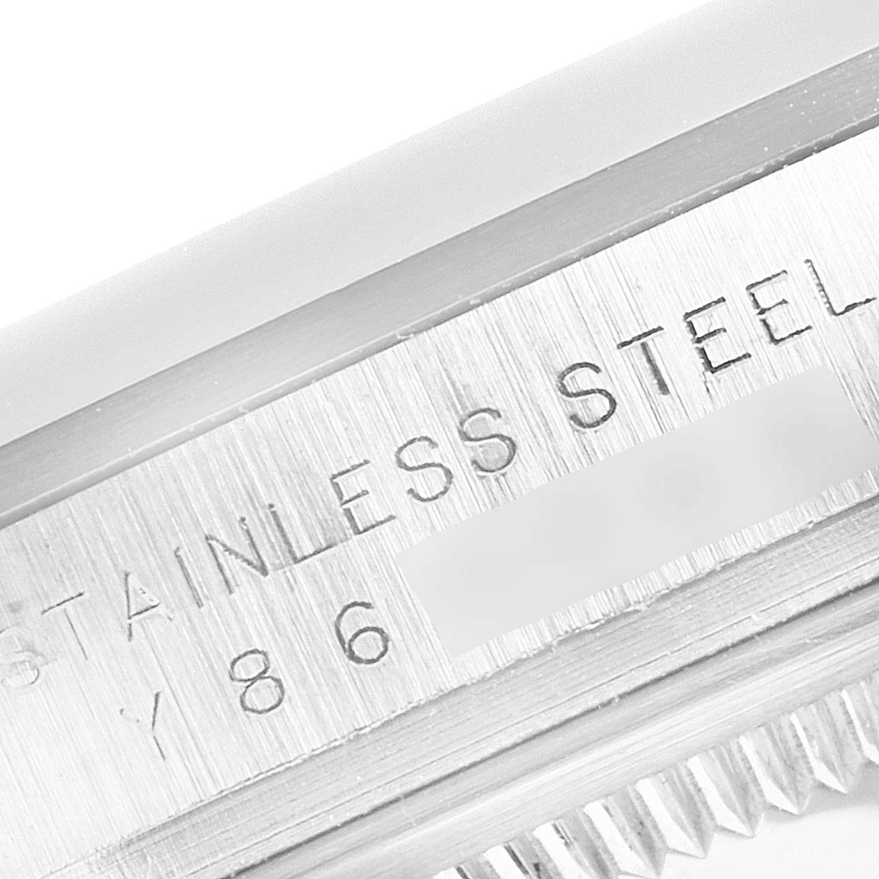 This close-up image shows the engraved text on the stainless steel casing of a Rolex Explorer 14270 Men
s Stainless Steel Black Dial 14270 Men
s Stainless Steel Black Dial watch.