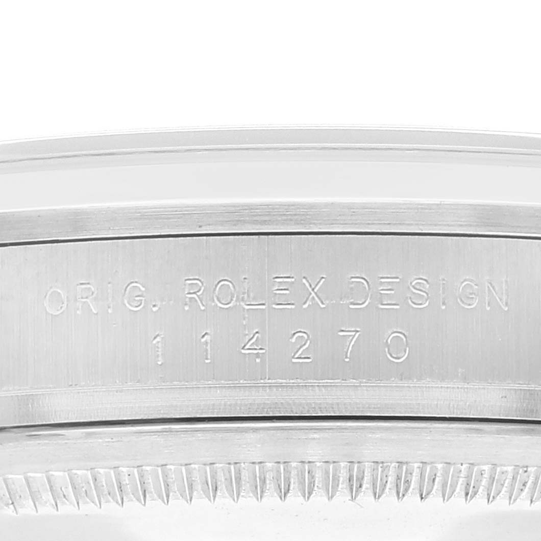 The image shows a close-up view of the case back and reference number (114270) of a Rolex Explorer 114270 Men's Stainless Steel Black Dial 114270 Men's Stainless Steel Black Dial watch.