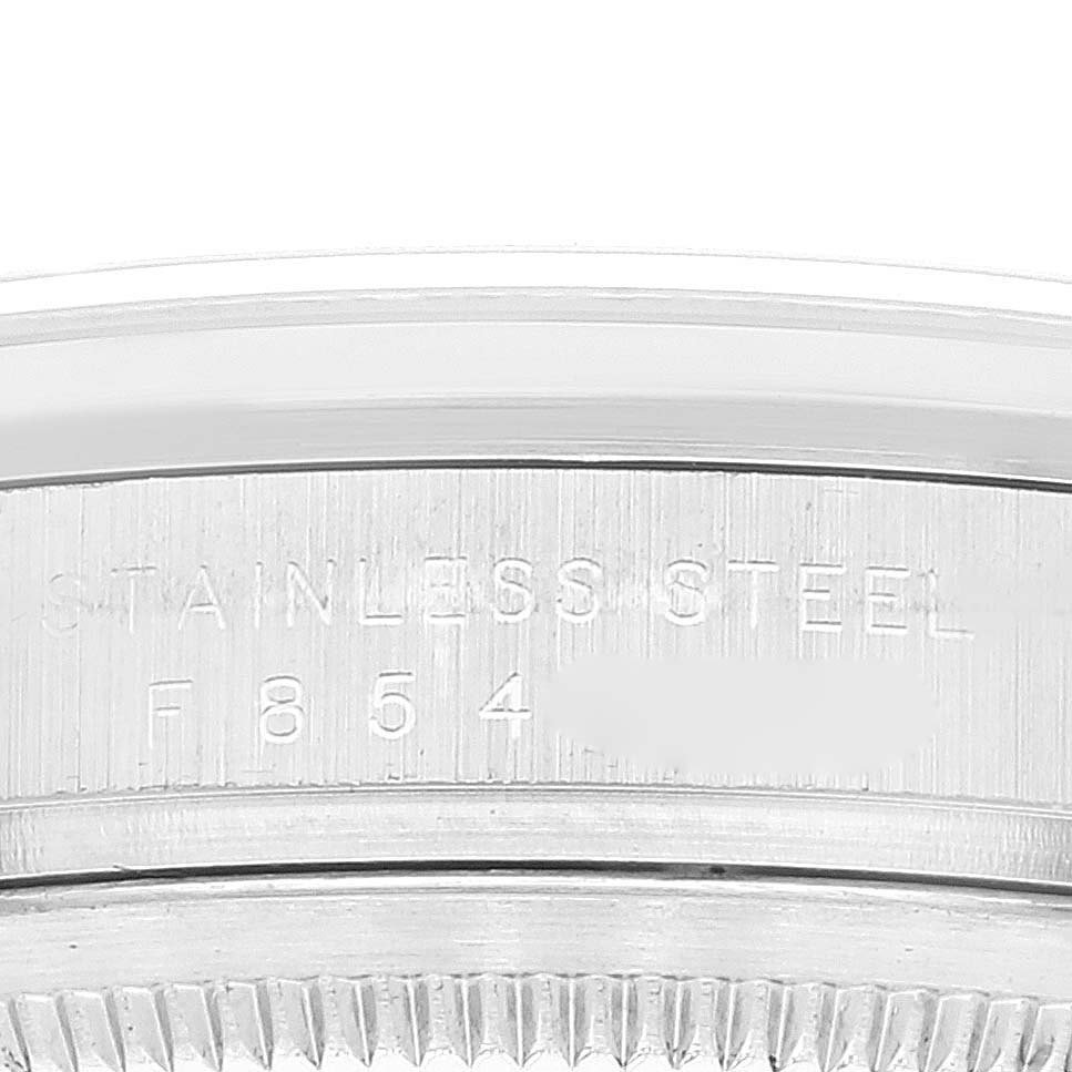 This image shows a close-up of the side of the Rolex Explorer 114270 Men's Stainless Steel Black Dial 114270 Men's Stainless Steel Black Dial model watch, highlighting the engraved serial number and "STAINLESS STEEL" text.