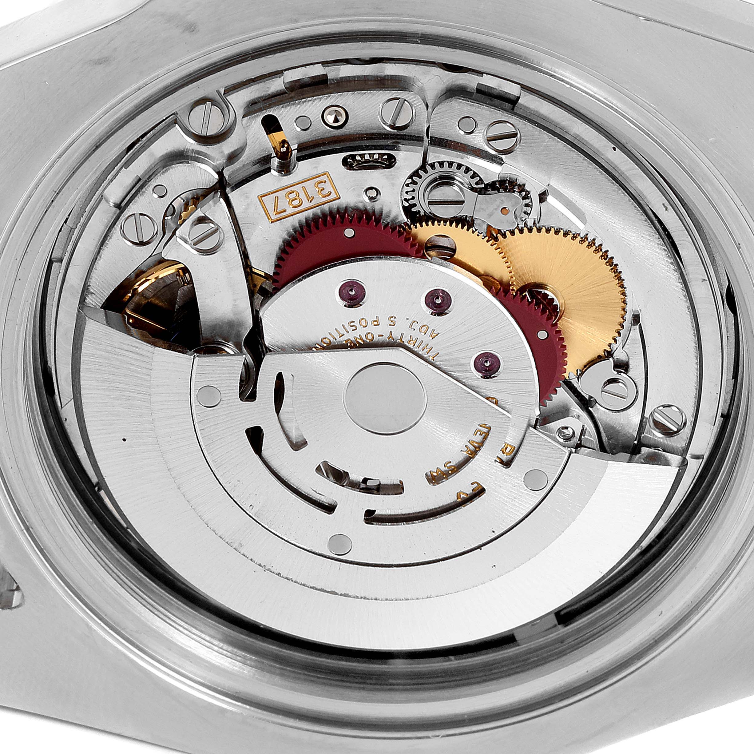 The image shows the inner mechanical movement of a Rolex Explorer 216570 Men's Stainless Steel Black Dial 216570 Men's Stainless Steel Black Dial watch, highlighting its intricate gears and components.