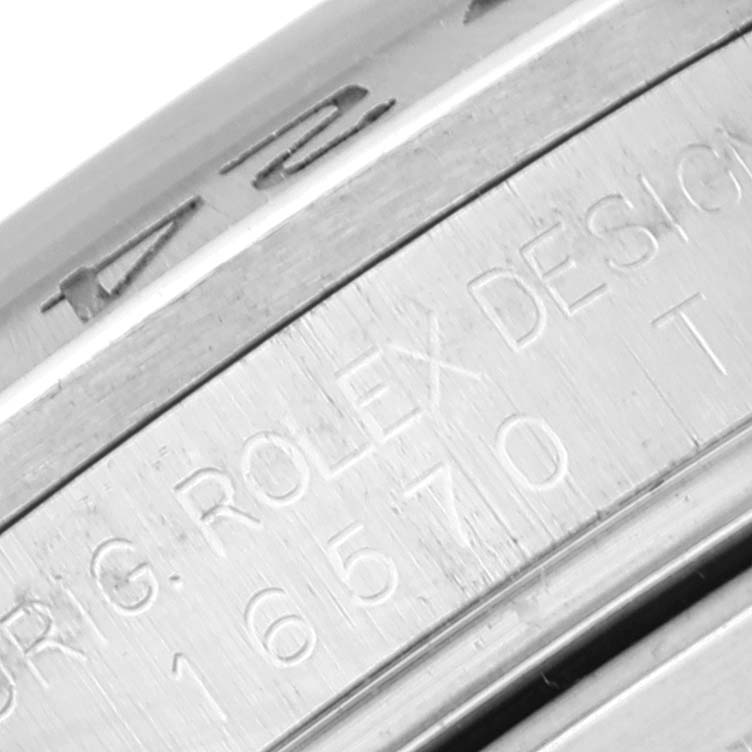 The image shows a close-up of the case side engraving on a Rolex Explorer 16570 Men's Stainless Steel White Dial 16570 Men's Stainless Steel White Dial watch, displaying model and design details.