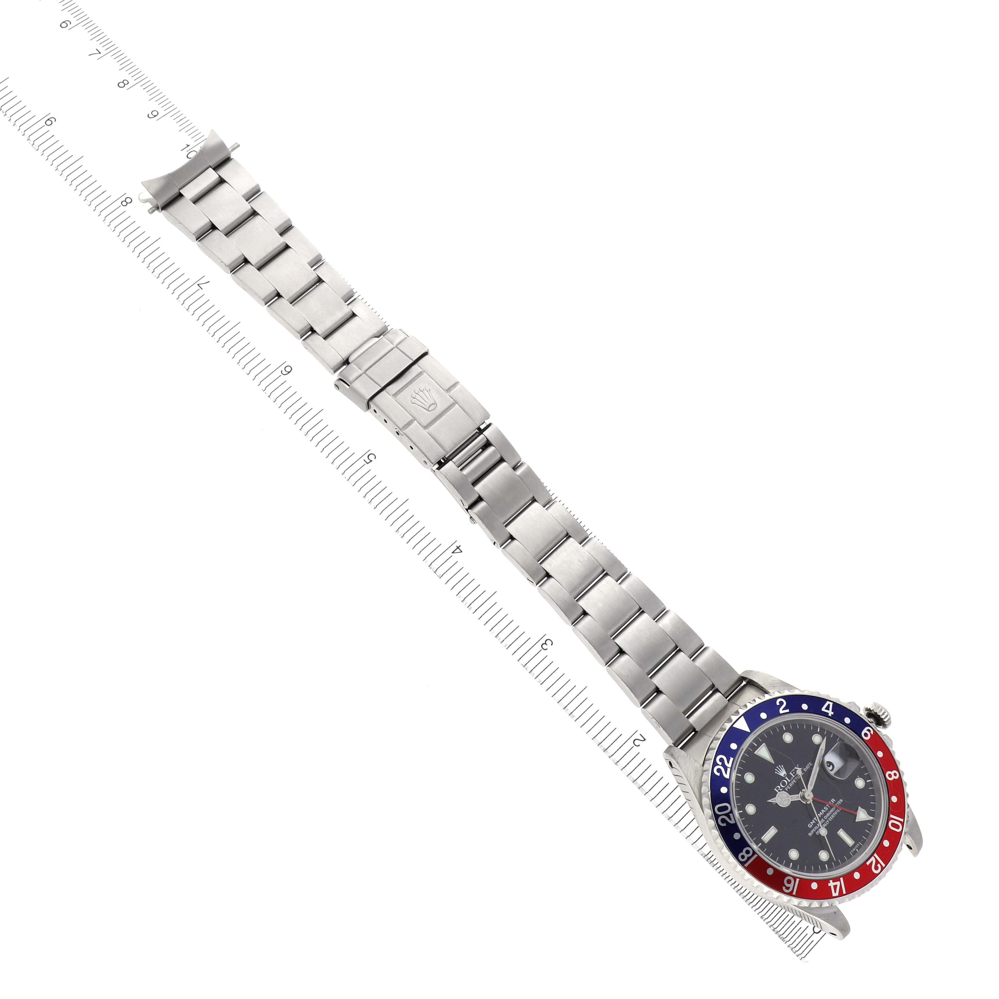 The Rolex GMT-Master 16700 Men's Stainless Steel Black Dial 16700 Men's Stainless Steel Black Dial watch is shown from a top-down angle, displaying the full bracelet and face.