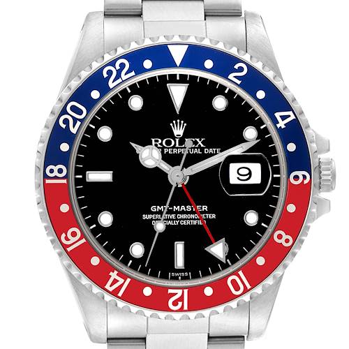 The image shows the face of a Rolex GMT-Master watch, highlighting the bezel, dial, hands, and date window.