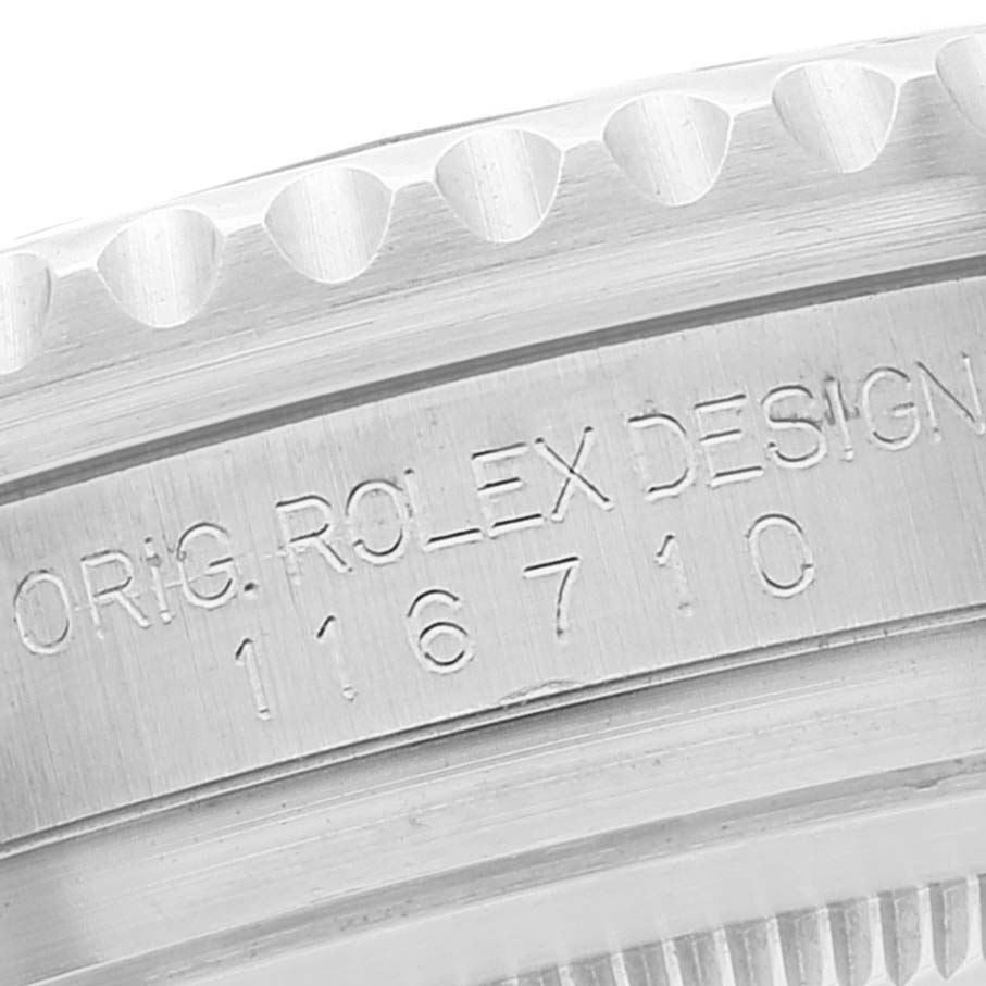 This image shows the side engraving and part of the bezel of the Rolex GMT-Master 116710 Men's Stainless Steel Black Dial 116710 Men's Stainless Steel Black Dial model 116710.