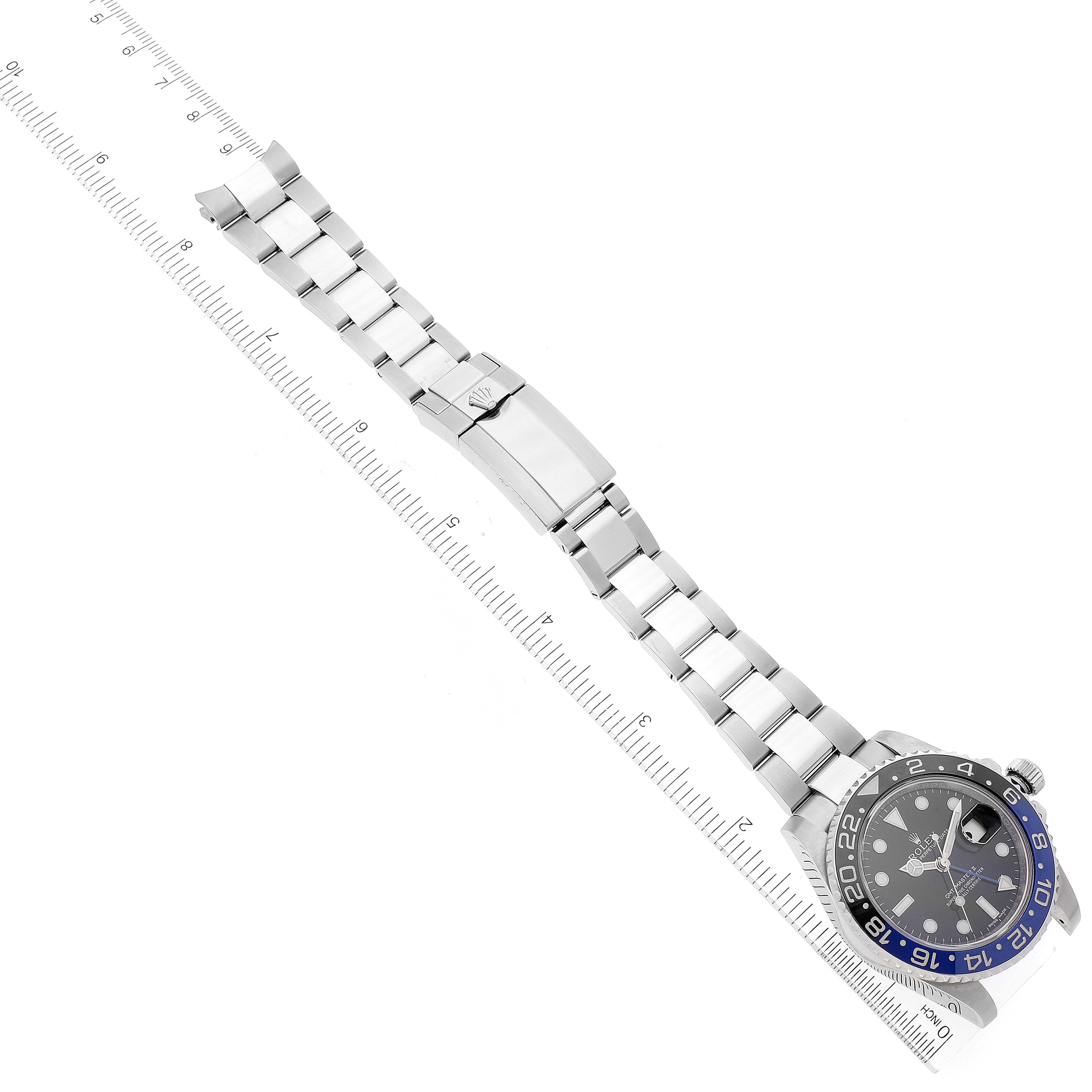 The image shows a Rolex GMT-Master 116710 Men's Stainless Steel Black Dial 116710 Men's Stainless Steel Black Dial watch laid flat with focus on the bracelet, clasp, and watch face, along with a measuring ruler beneath it.
