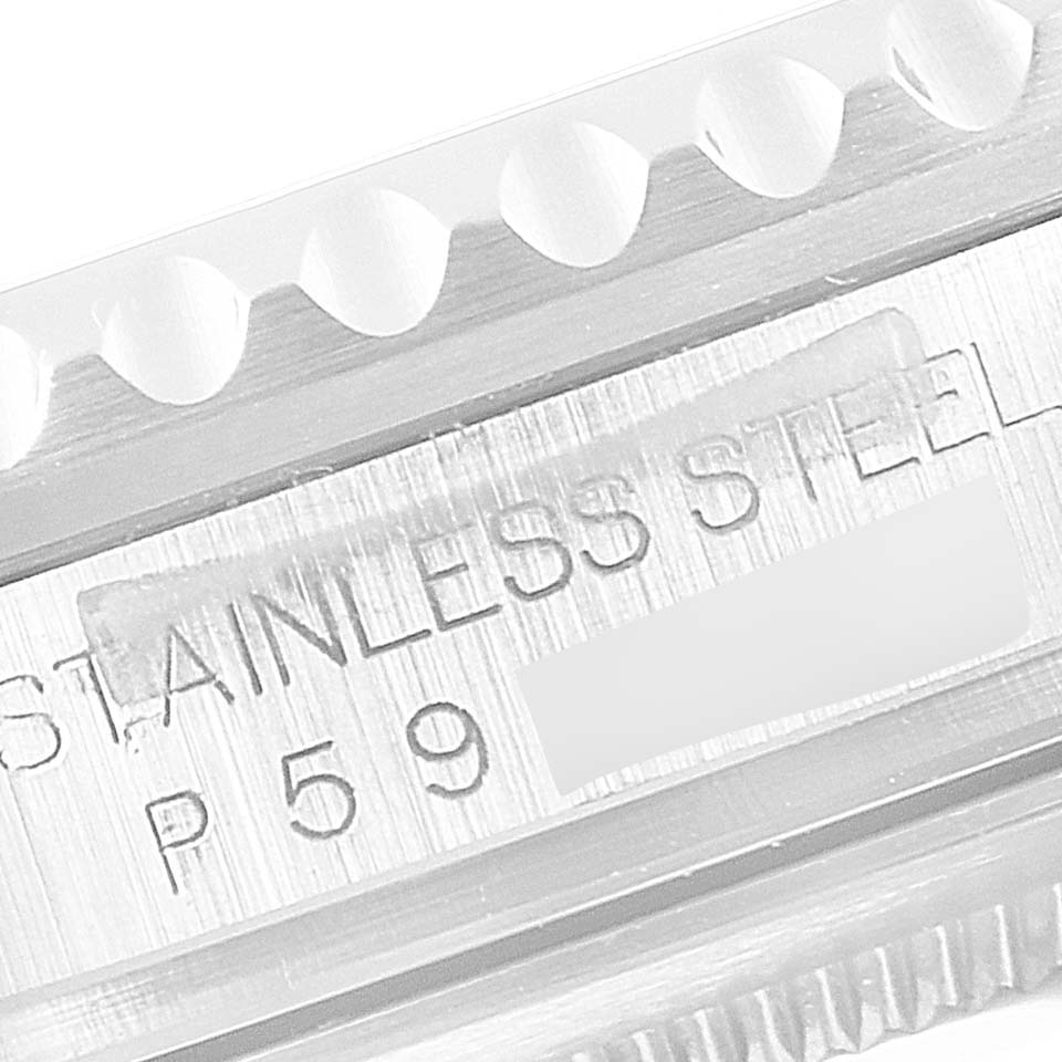 The image shows a close-up of the side of a Rolex GMT-Master 16710 Men
s Stainless Steel Black Dial 16710 Men
s Stainless Steel Black Dial watch, focusing on the engraving that reads "STAINLESS STEEL P59."