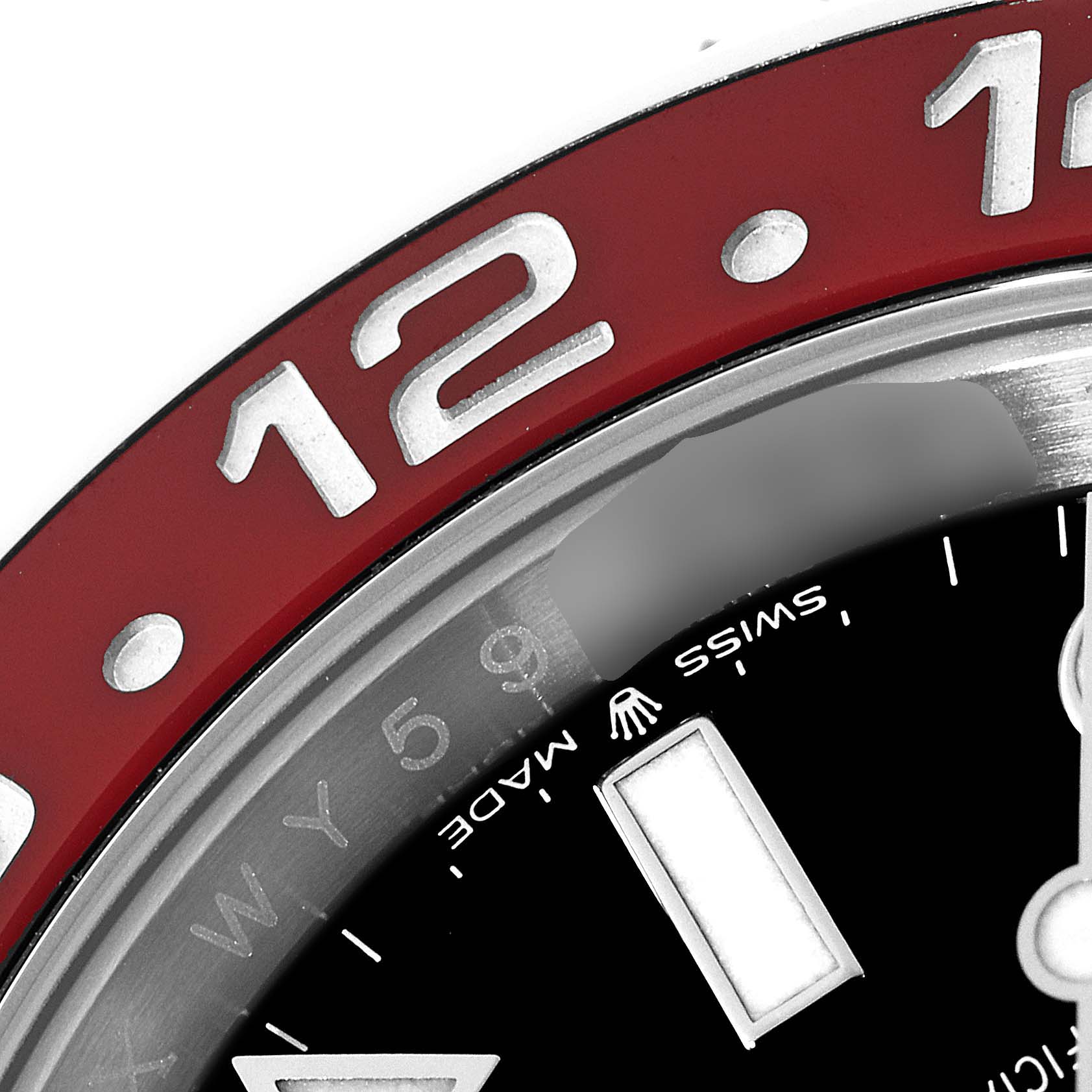 The image shows a close-up of the bezel and part of the dial of a Rolex GMT-Master 126710 Men's Stainless Steel Black Dial 126710 Men's Stainless Steel Black Dial watch, highlighting the "12" marker and "Swiss Made" text.