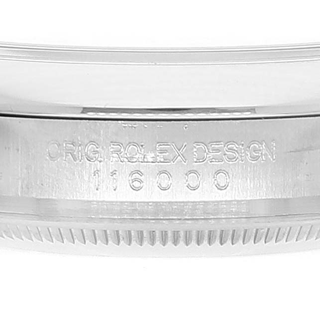 The image shows a side view of a Rolex Oyster Perpetual 116000 Men's Stainless Steel Black Dial 116000 Men's Stainless Steel Black Dial watch case with the engraving "ORIG. ROLEX DESIGN 116000."