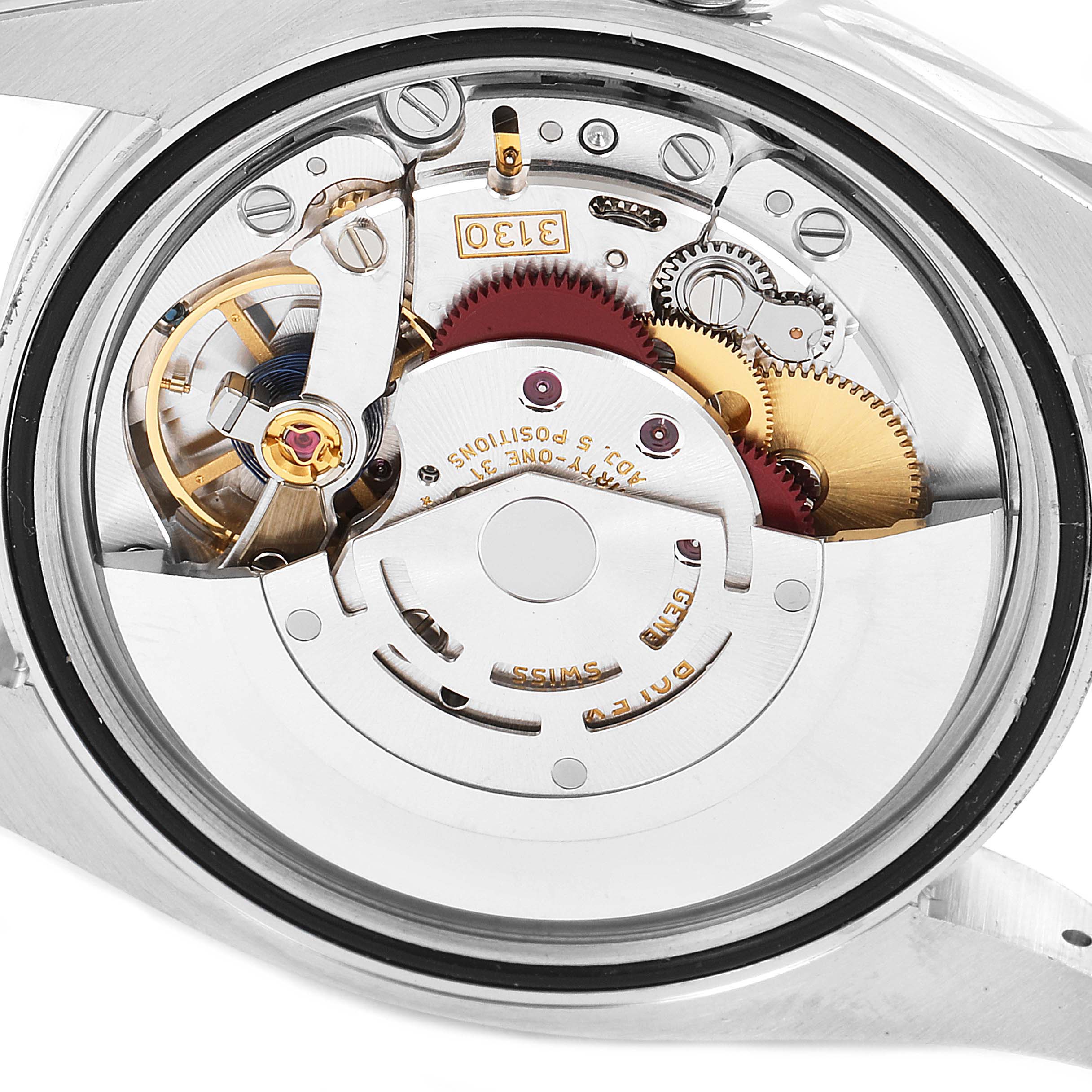 The image shows a close-up view of the internal mechanism of a Rolex Oyster Perpetual 116000 Men's Stainless Steel Champagne Dial 116000 Men's Stainless Steel Champagne Dial watch.