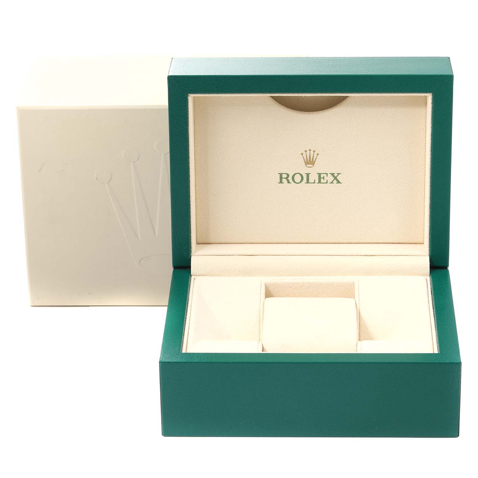 This image shows the open green and cream presentation box for a Rolex Oyster Perpetual 116000 Men's Stainless Steel Champagne Dial 116000 Men's Stainless Steel Champagne Dial watch.